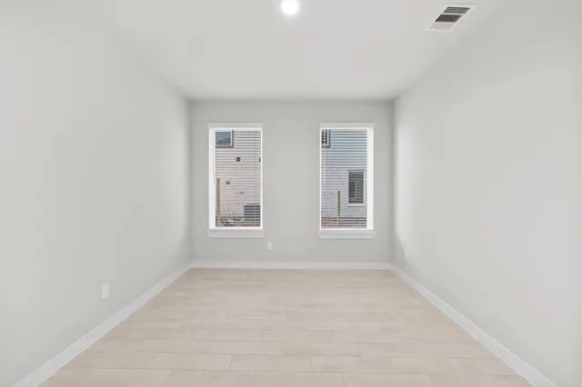 an empty room with windows