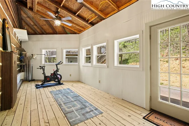 a outdoor living space with furniture and a rug