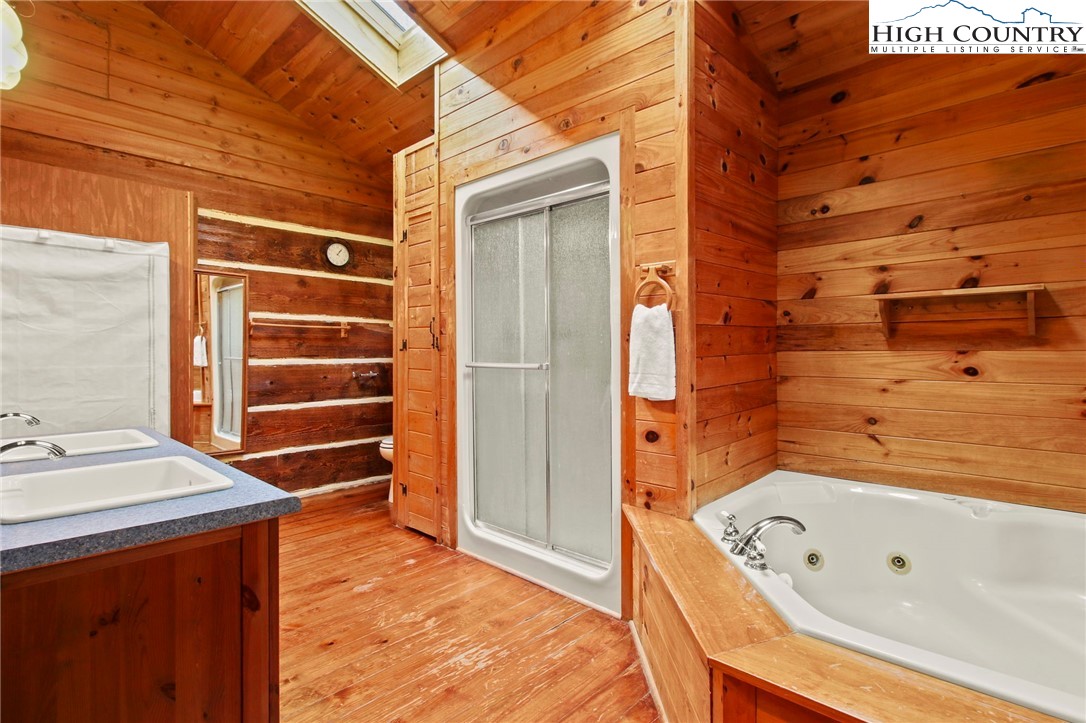 690-692 Lynn Hill Road Vilas, NC 28692 - Photo 40 of 50 a bathroom with a bathtub and shower