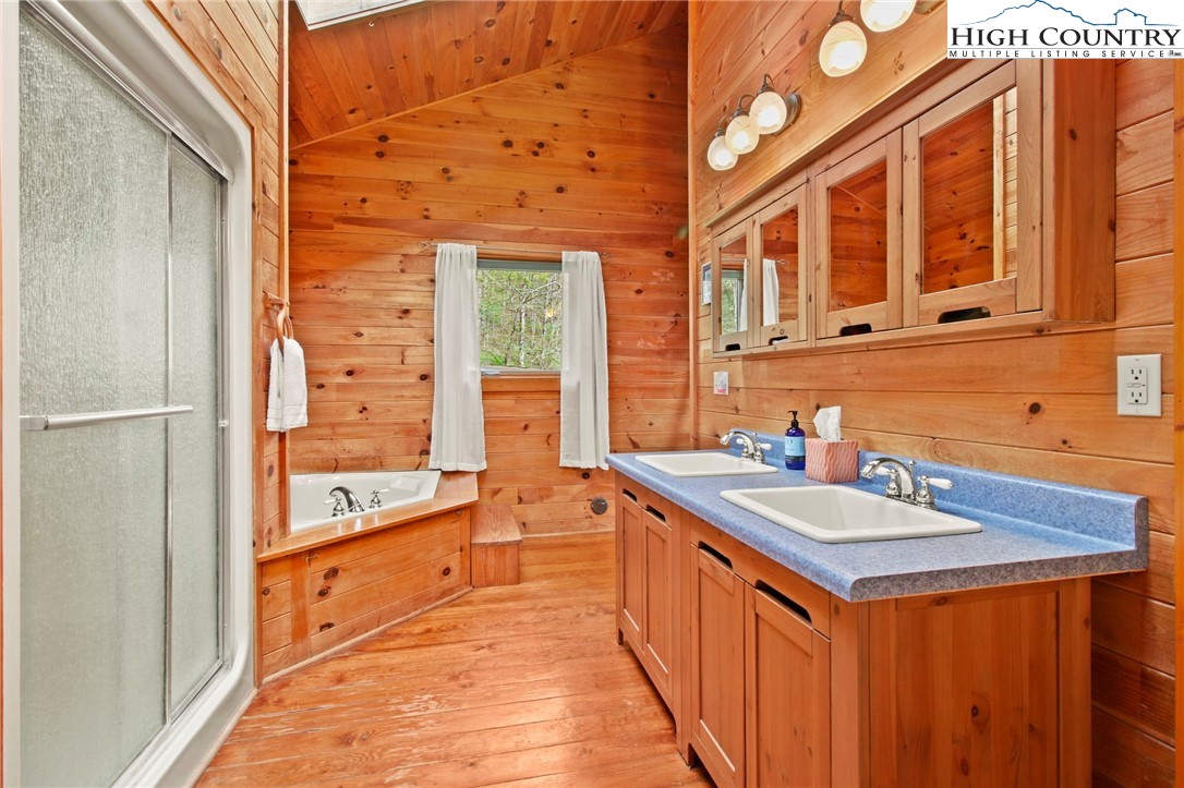 690-692 Lynn Hill Road Vilas, NC 28692 - Photo 41 of 50 a bathroom with sink and a mirror
