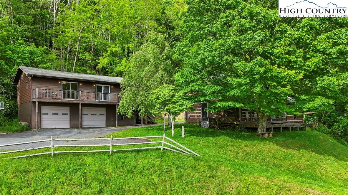 690-692 Lynn Hill Road Vilas, NC 28692 - Photo 8 of 50 a view of a house with a backyard