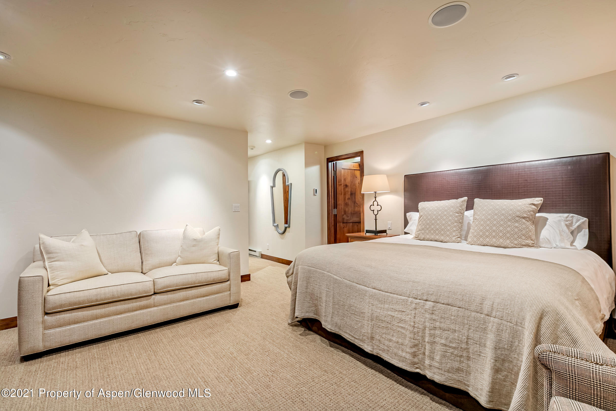 851 Ute Avenue, Unit A Aspen, CO 81611 - Photo 14 of 20 a spacious bedroom with a bed and a couch