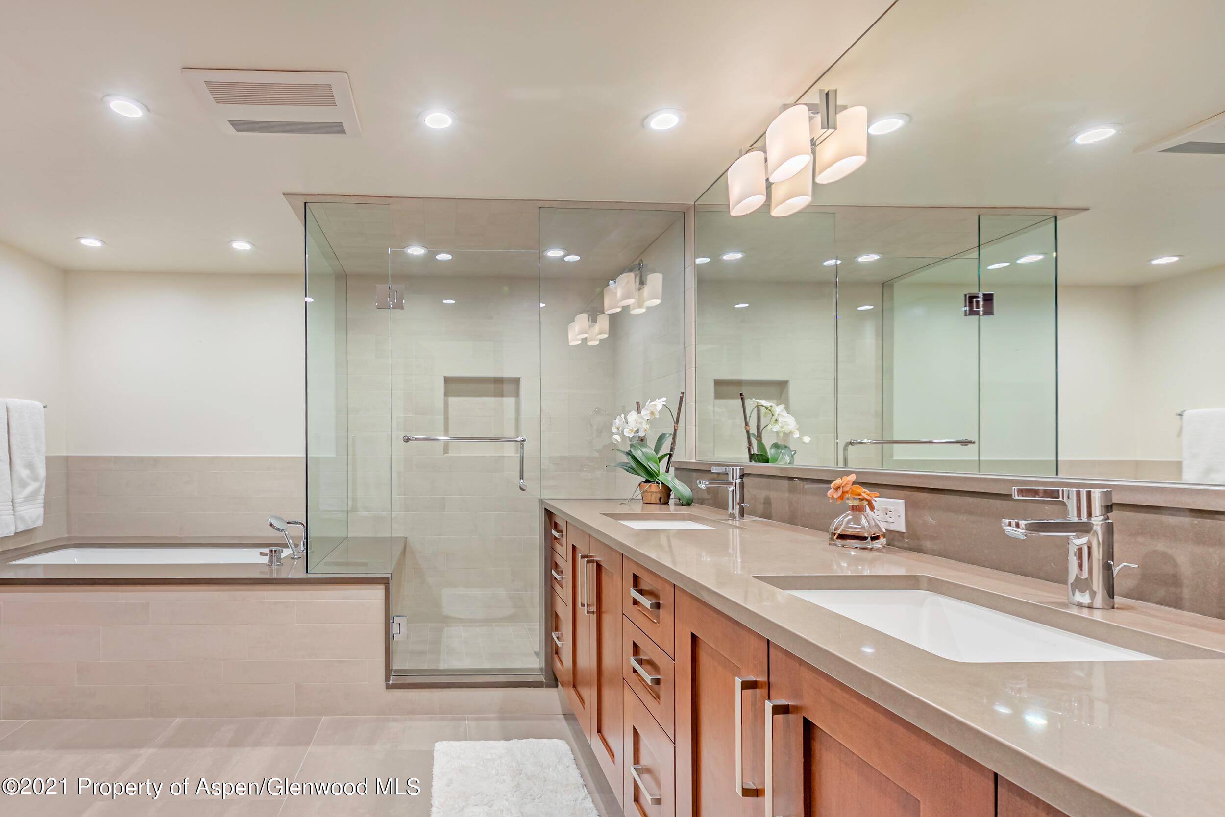 851 Ute Avenue, Unit A Aspen, CO 81611 - Photo 17 of 20 a bathroom with a double vanity sink and a mirror