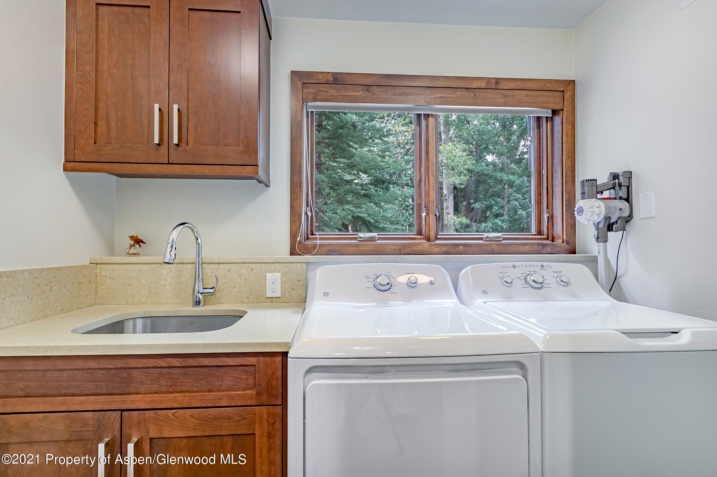 851 Ute Avenue, Unit A Aspen, CO 81611 - Photo 19 of 20 a utility room with sink dryer and washer