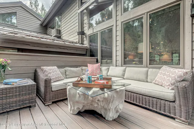 a outdoor living space with patio furniture and garden view
