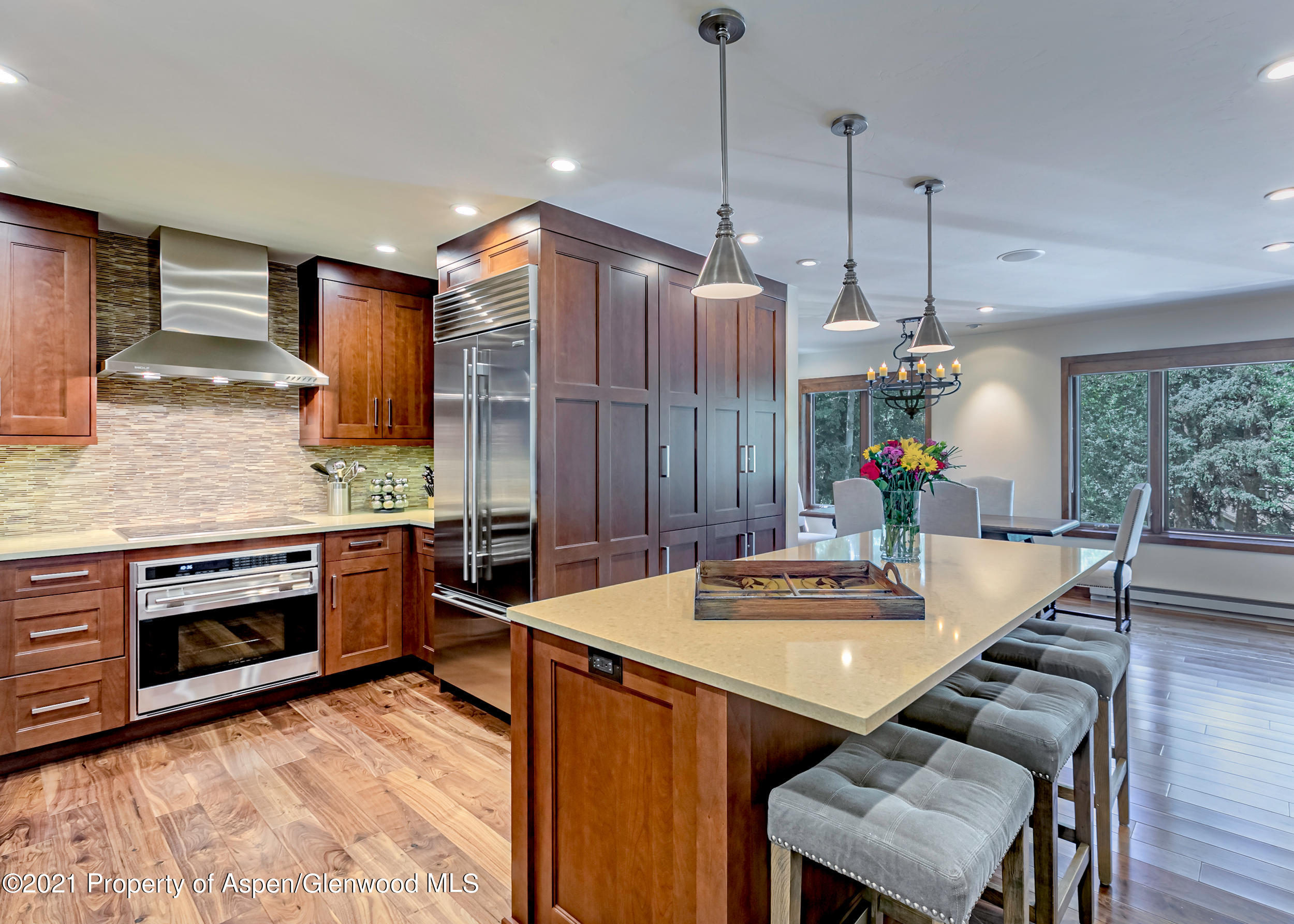 851 Ute Avenue, Unit A Aspen, CO 81611 - Photo 5 of 20 a kitchen with a table and chairs in it