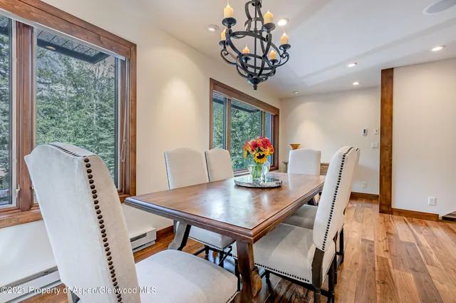 a view of a dining room with furniture window and wooden floor