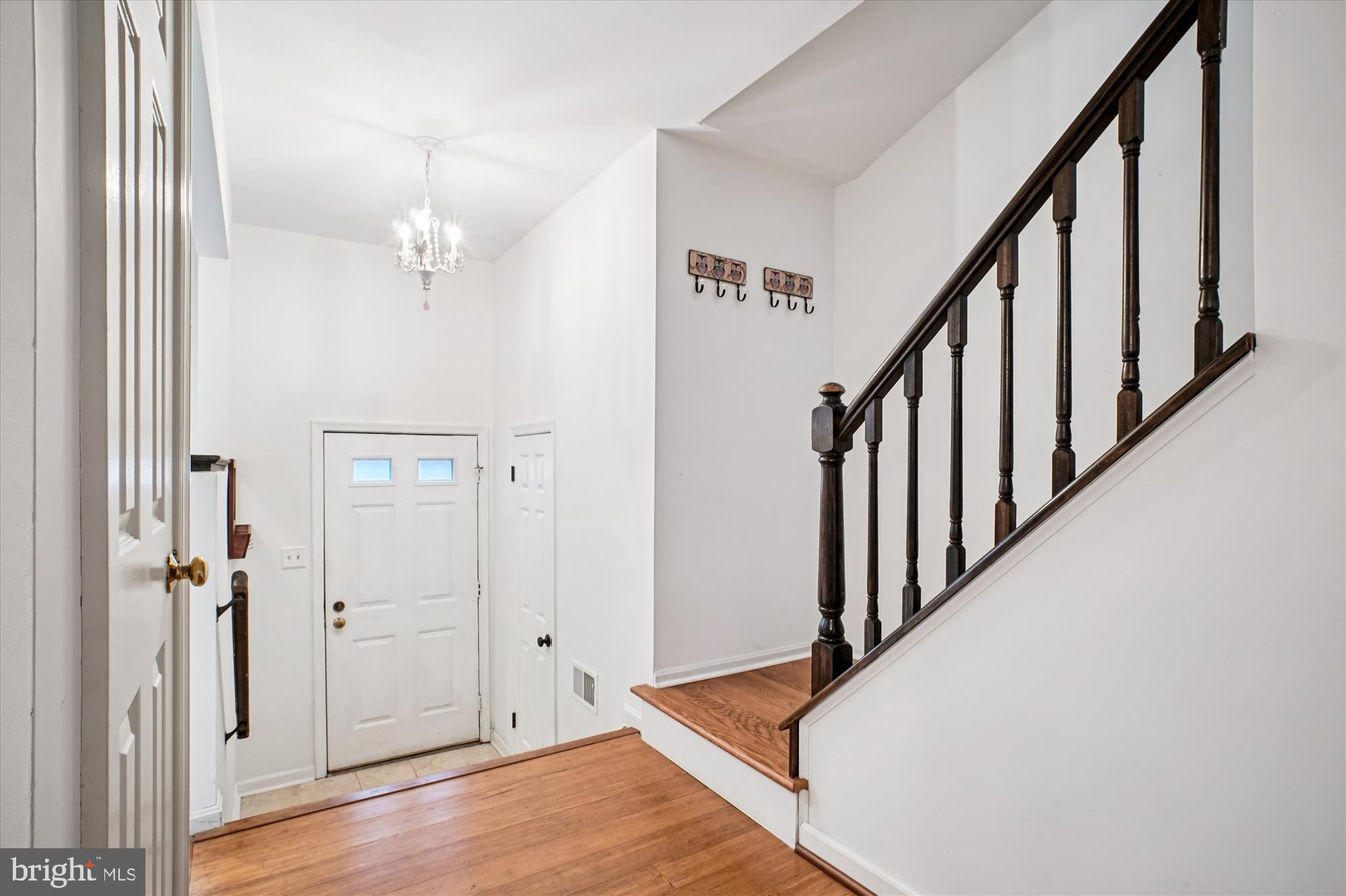 2816 Kelly Square Vienna, VA 22181 - Photo 12 of 73 a view of a hallway with wooden floor and staircase