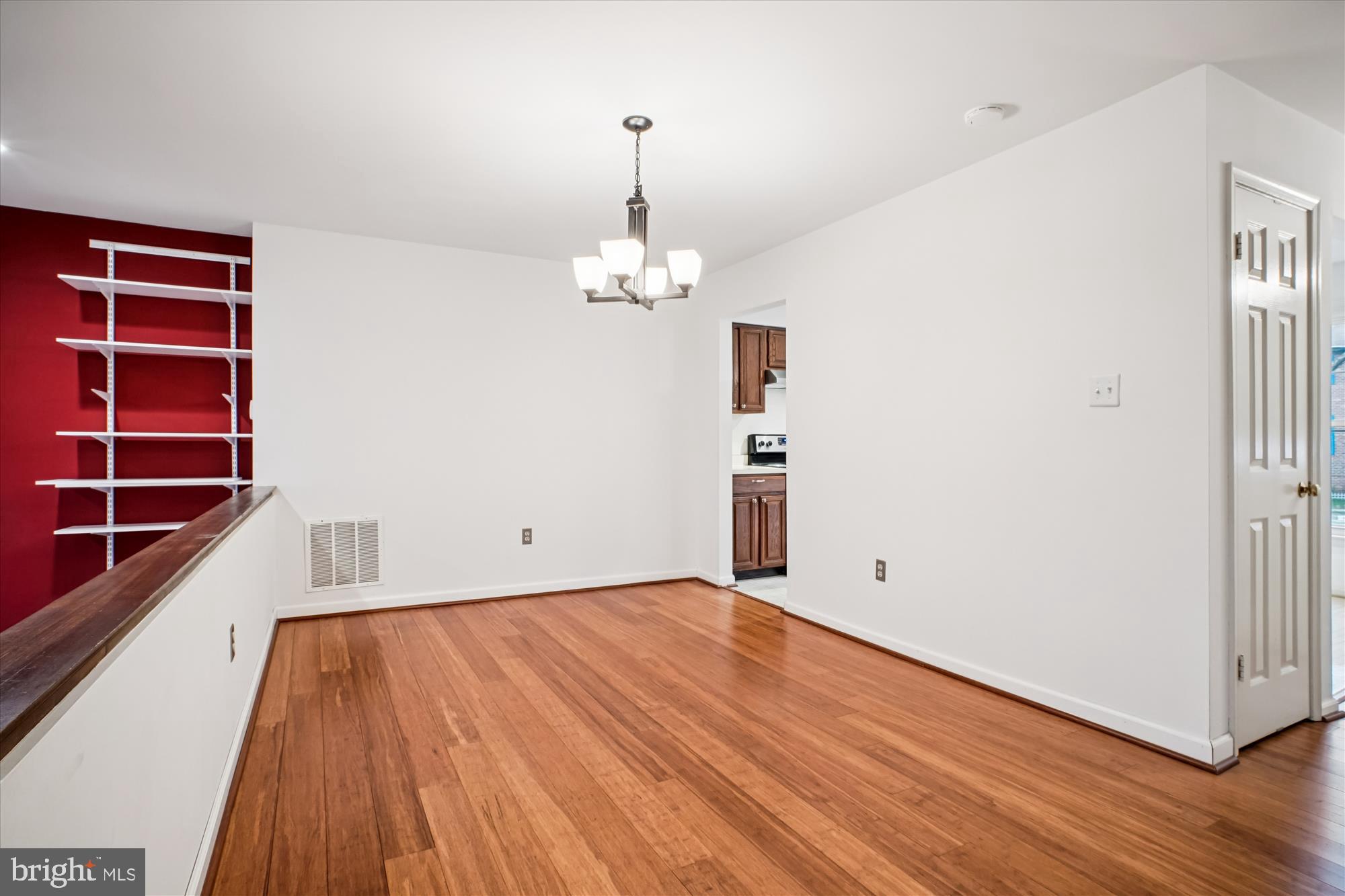 2816 Kelly Square Vienna, VA 22181 - Photo 20 of 73 a view of a room with wooden floor and stairs