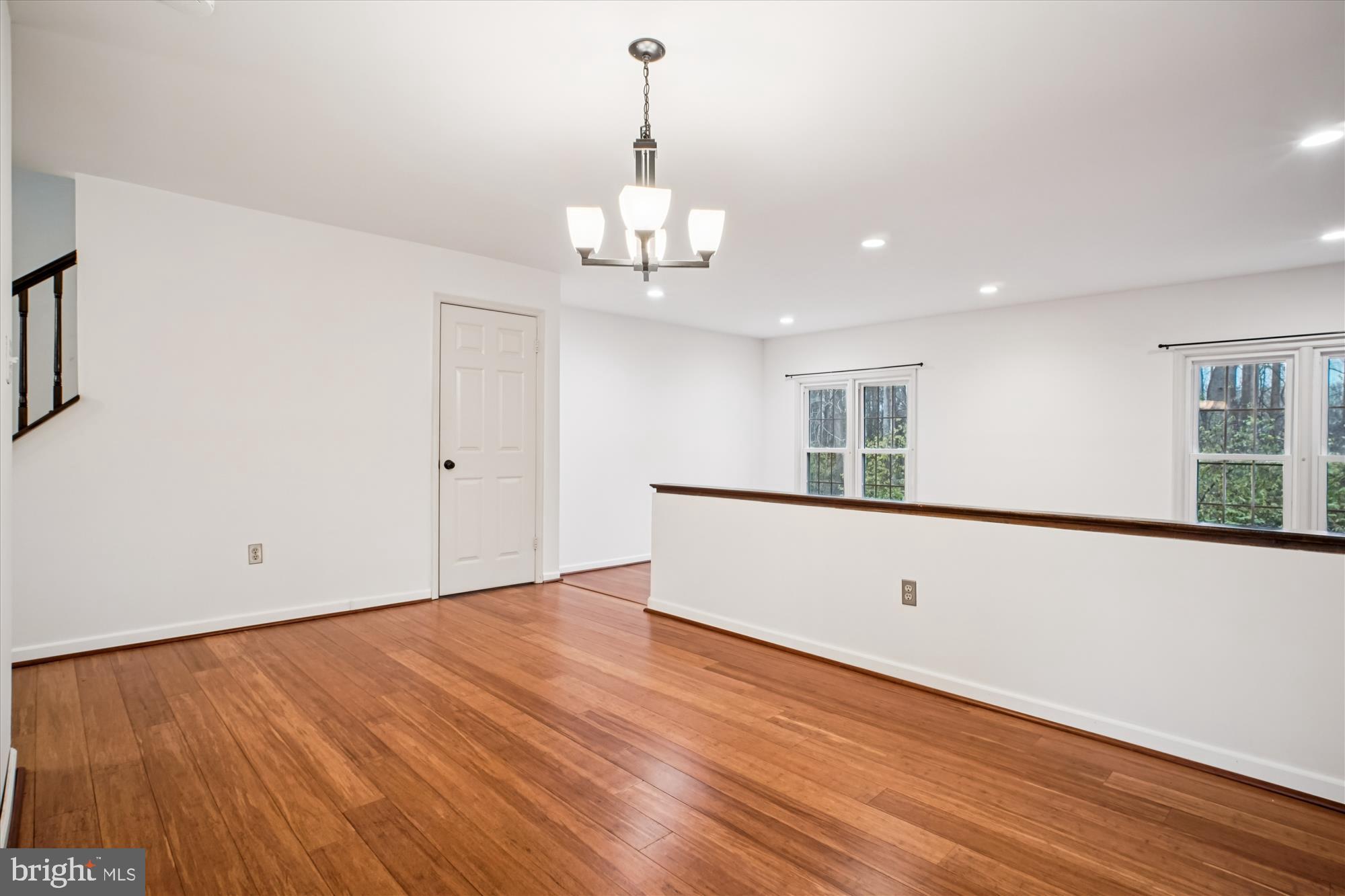 2816 Kelly Square Vienna, VA 22181 - Photo 21 of 73 a view of an empty room with wooden floor and a window
