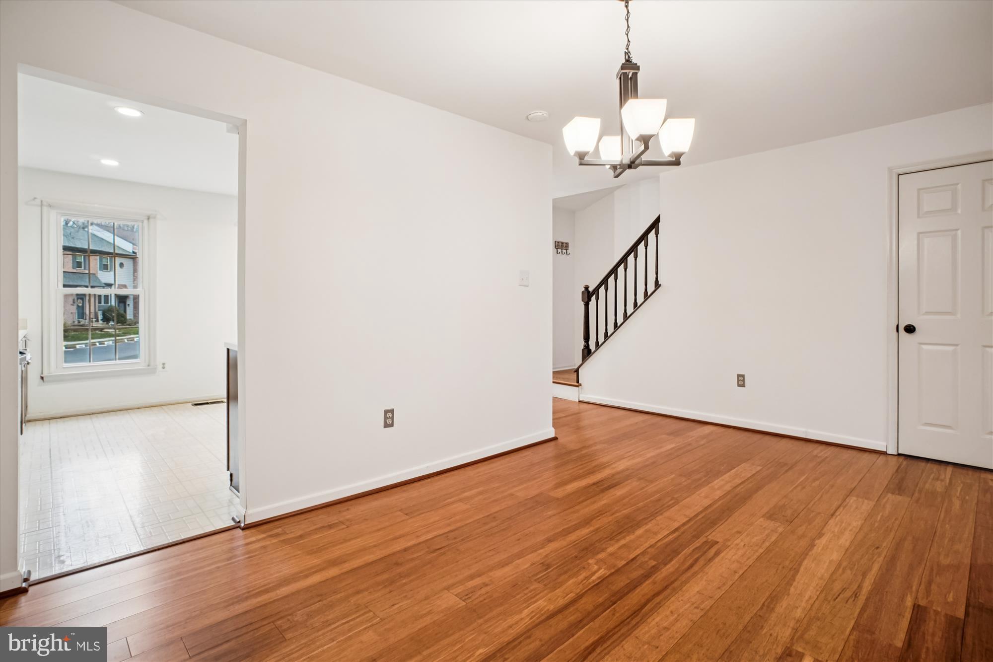 2816 Kelly Square Vienna, VA 22181 - Photo 22 of 73 a view of a room with wooden floor and chandelier