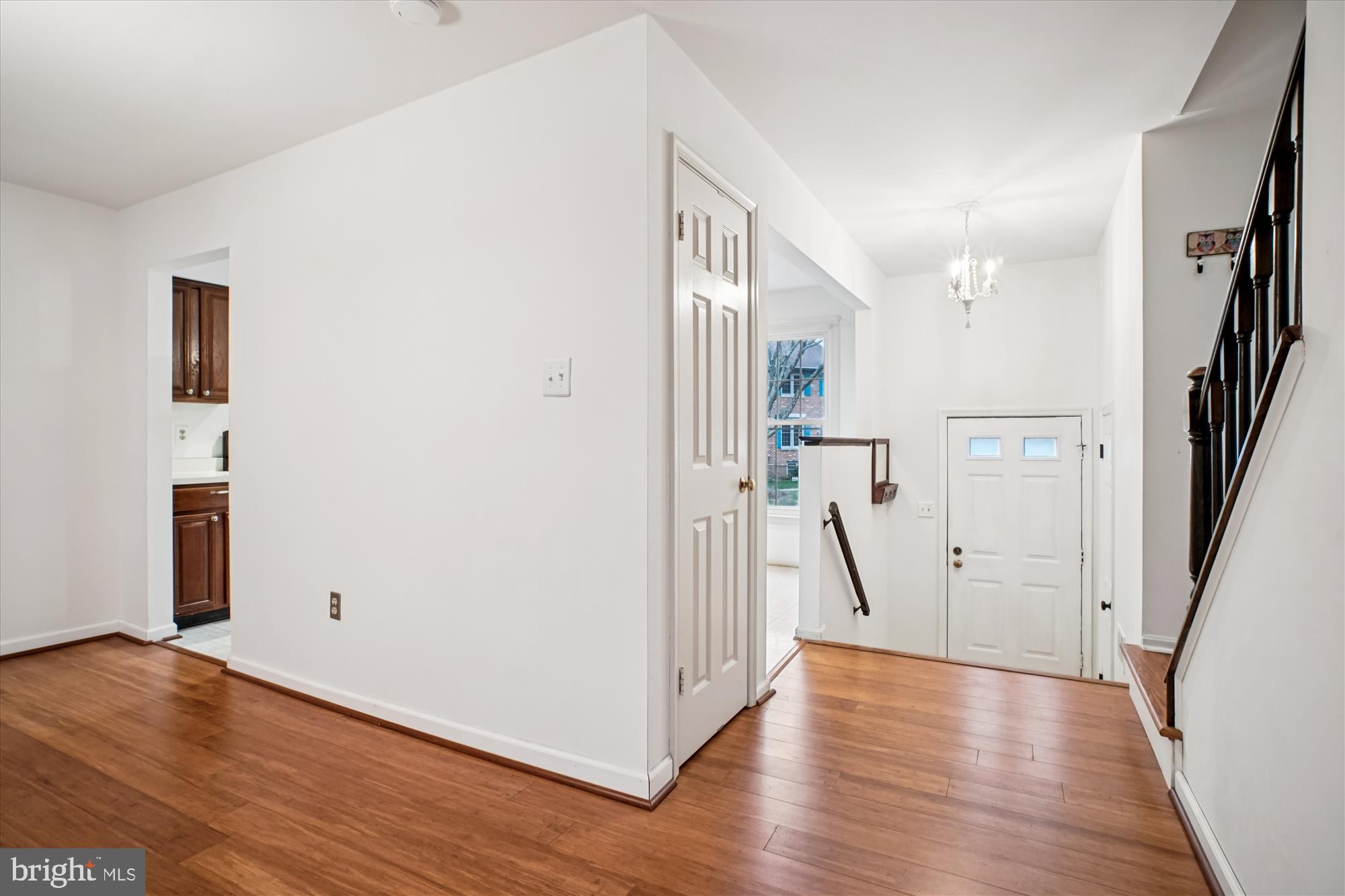 2816 Kelly Square Vienna, VA 22181 - Photo 23 of 73 a view of empty room with wooden floor and stairs