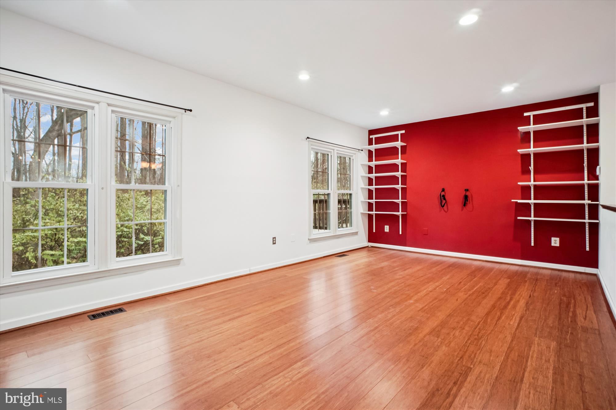 2816 Kelly Square Vienna, VA 22181 - Photo 24 of 73 a view of an empty room with a window and wooden floor