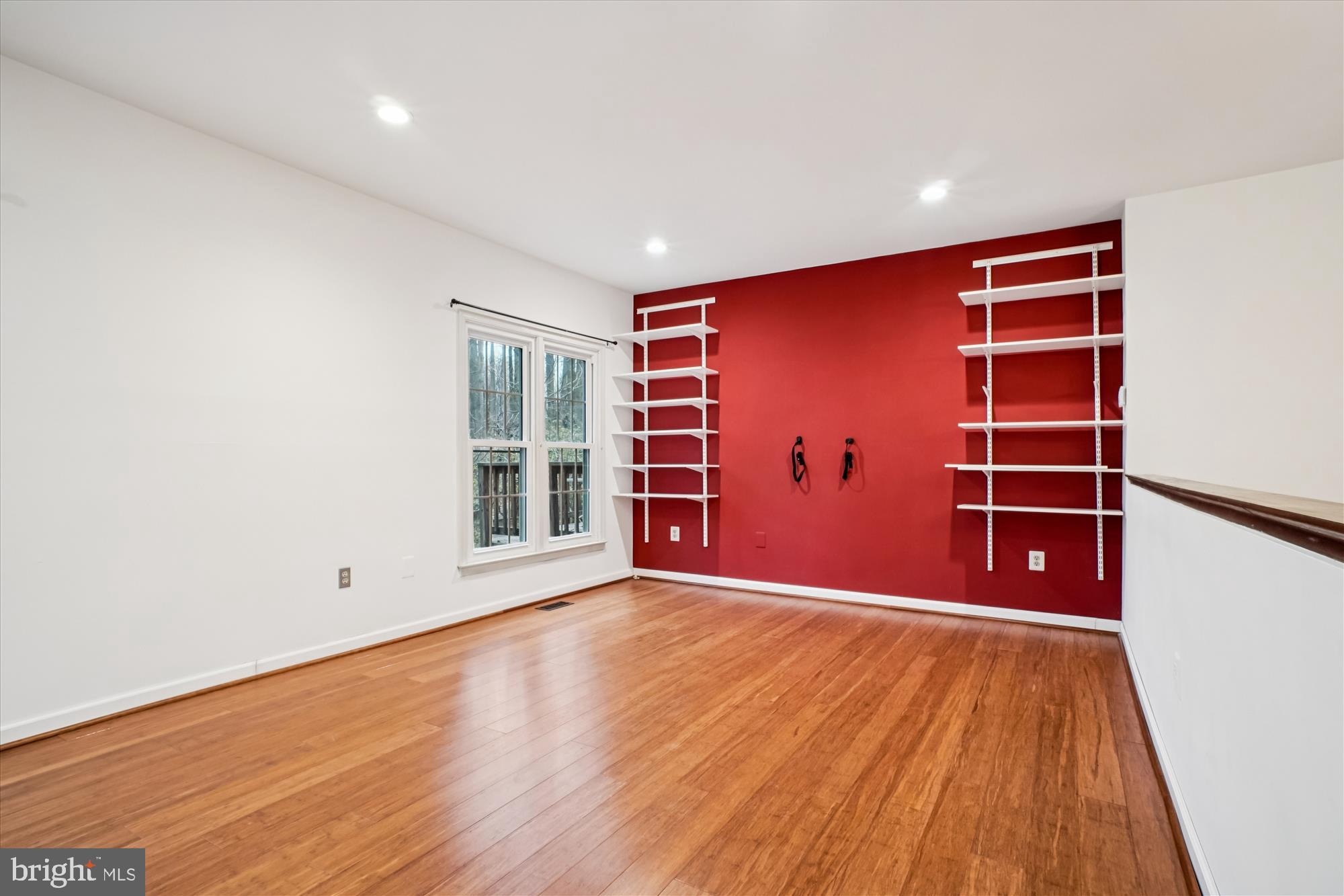 2816 Kelly Square Vienna, VA 22181 - Photo 26 of 73 a view of an empty room with wooden floor and a window