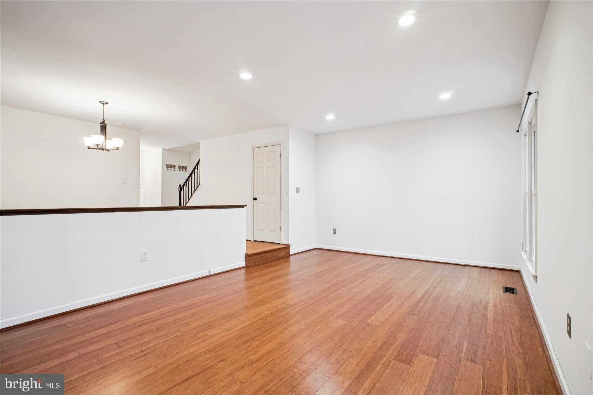 2816 Kelly Square Vienna, VA 22181 - Photo 27 of 73 wooden floor in an empty room with a window