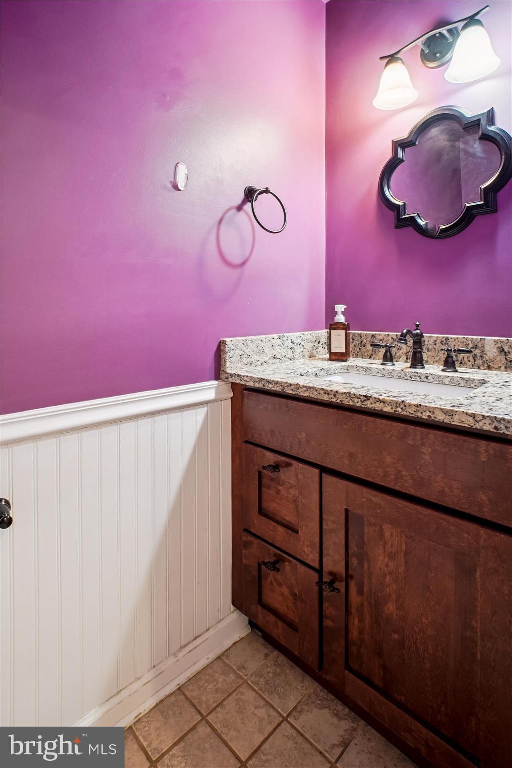 2816 Kelly Square Vienna, VA 22181 - Photo 29 of 73 a bathroom with a sink and a mirror