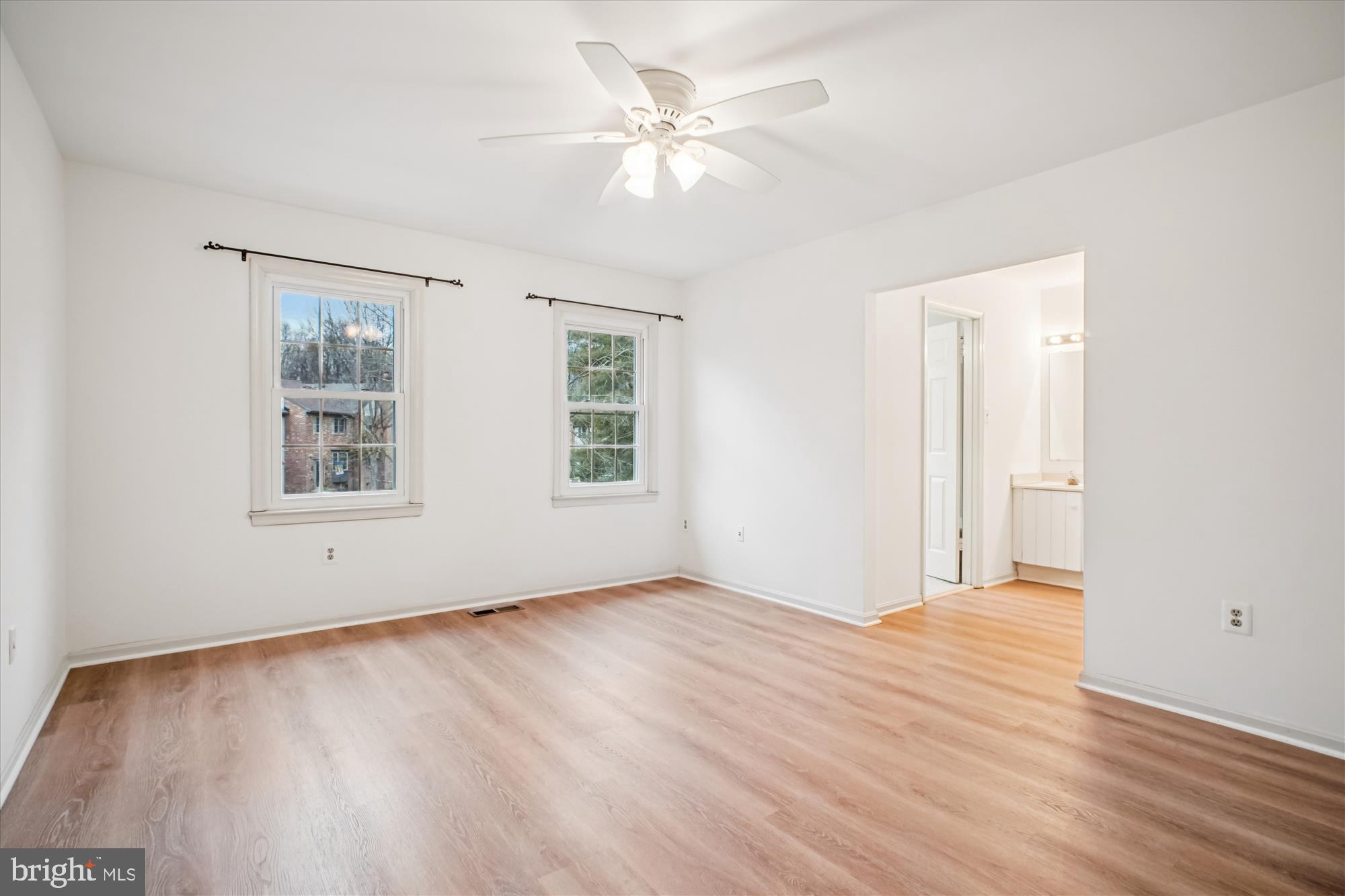 2816 Kelly Square Vienna, VA 22181 - Photo 34 of 73 an empty room with wooden floor chandelier fan and windows