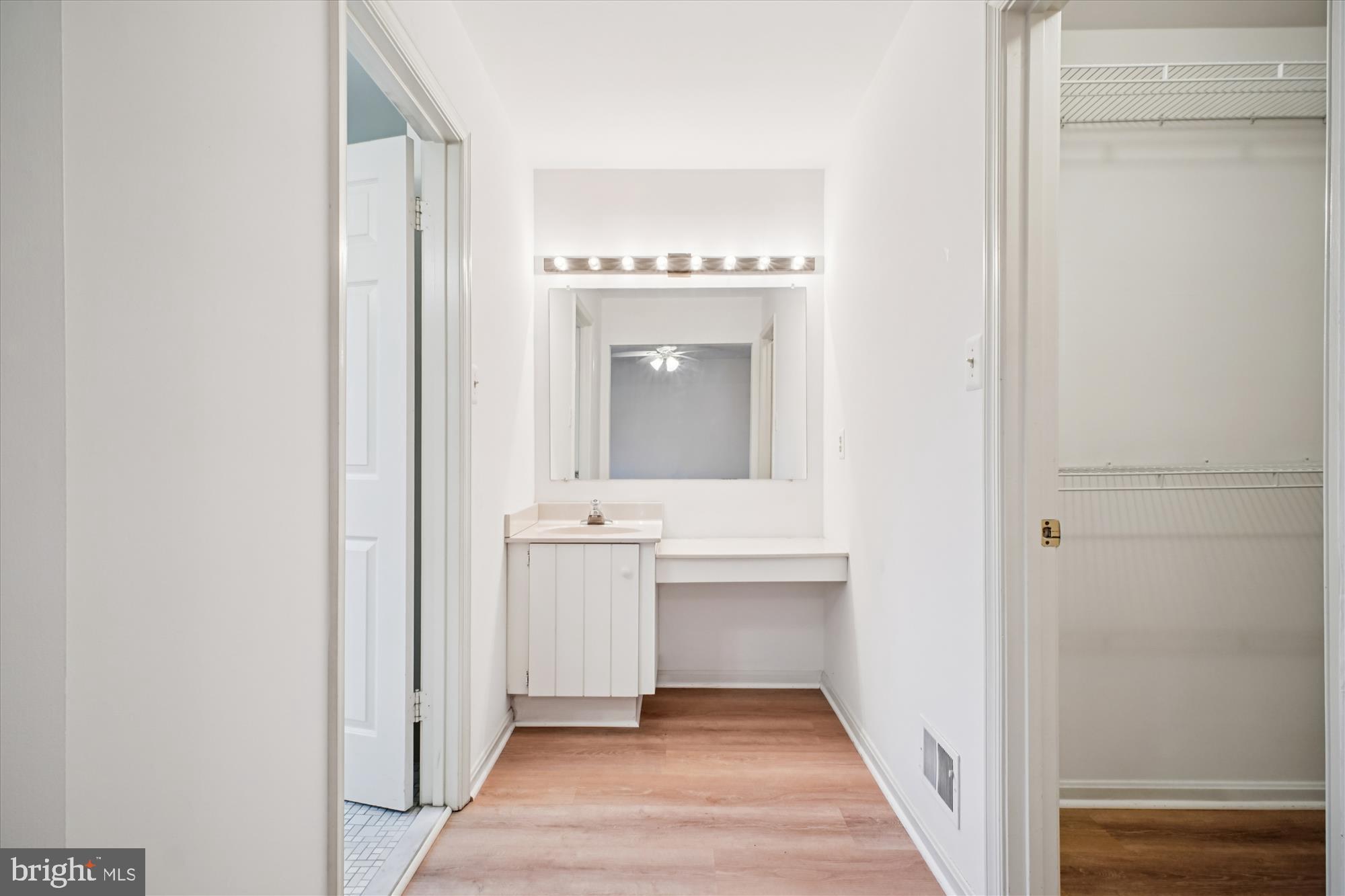 2816 Kelly Square Vienna, VA 22181 - Photo 40 of 73 a view of a hallway view with wooden floor and a bathroom