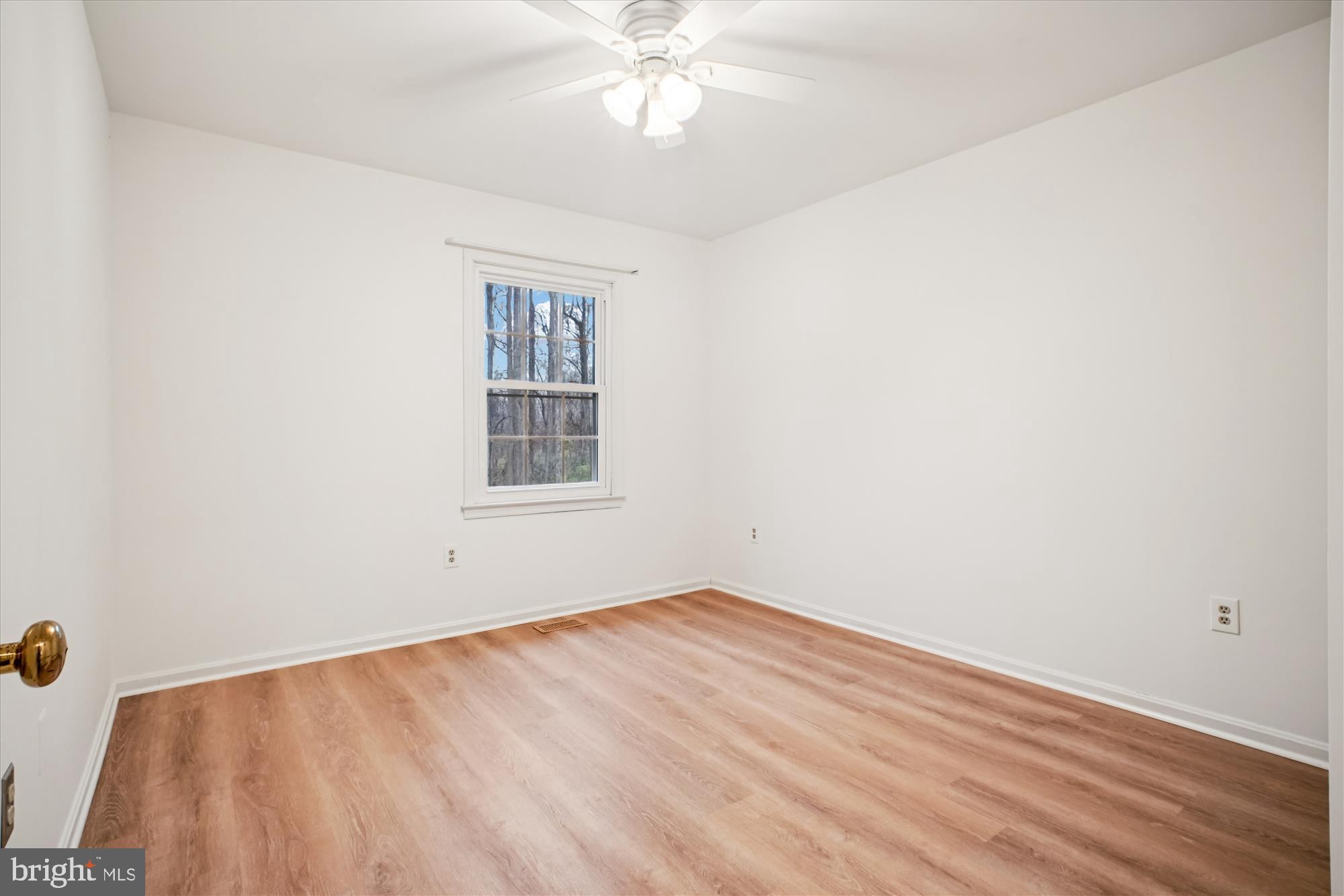 2816 Kelly Square Vienna, VA 22181 - Photo 43 of 73 an empty room with a window and a ceiling fan