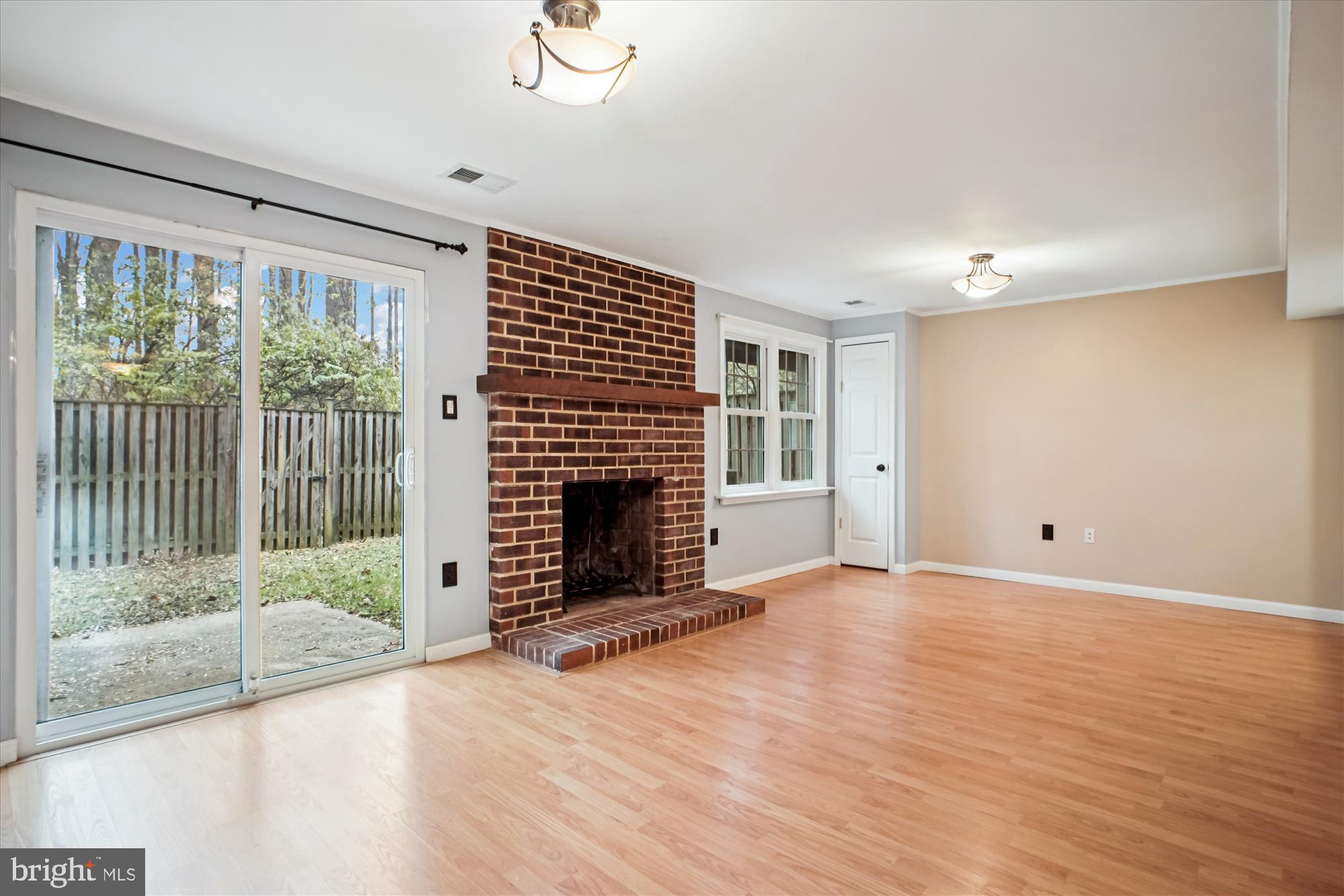 2816 Kelly Square Vienna, VA 22181 - Photo 50 of 73 a view of an empty room with a fireplace and a window