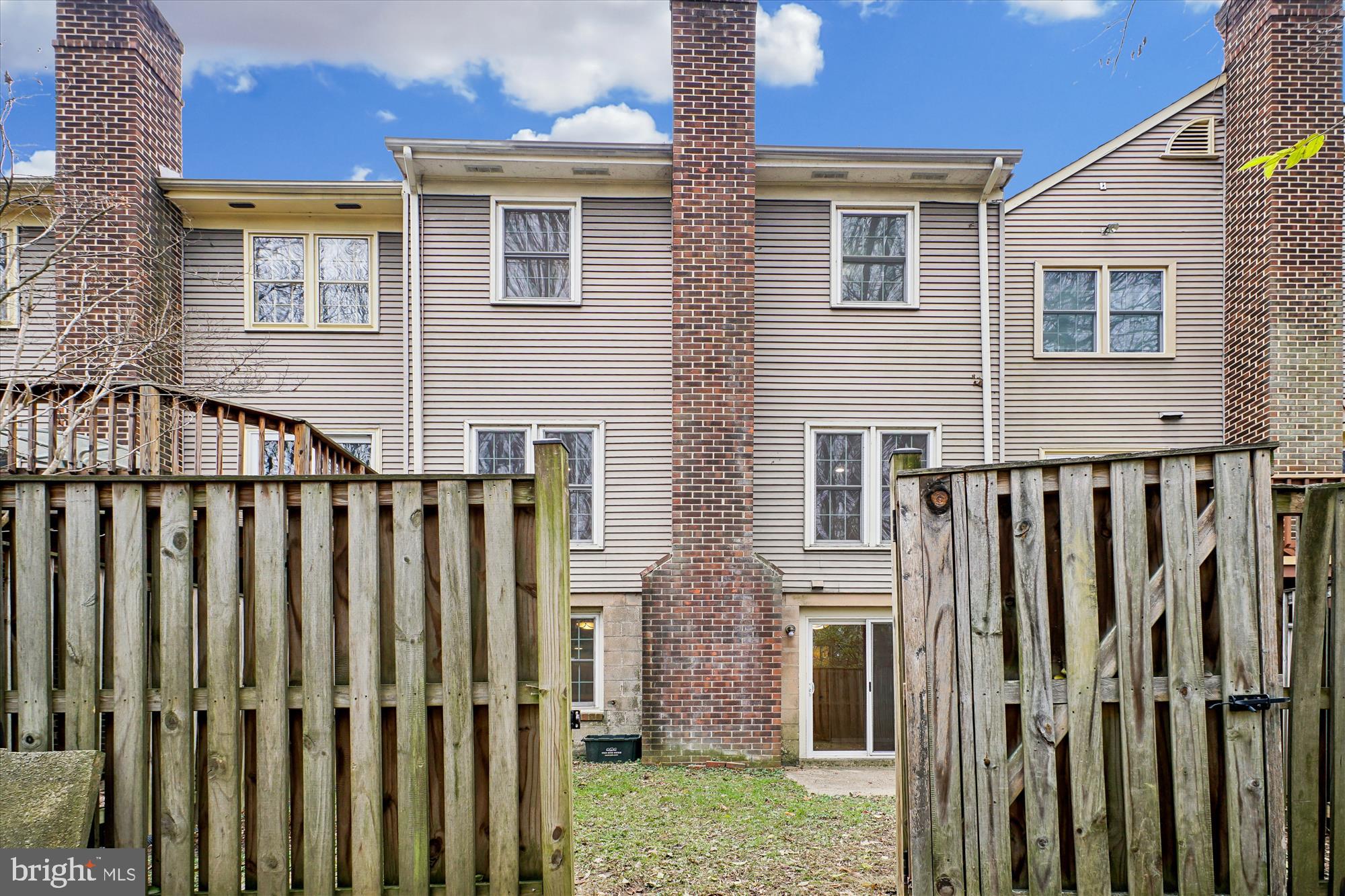 2816 Kelly Square Vienna, VA 22181 - Photo 5 of 73 a view of a house with wooden fence