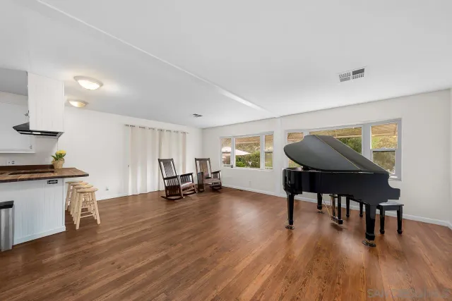 a view of a livingroom with furniture and wooden floor