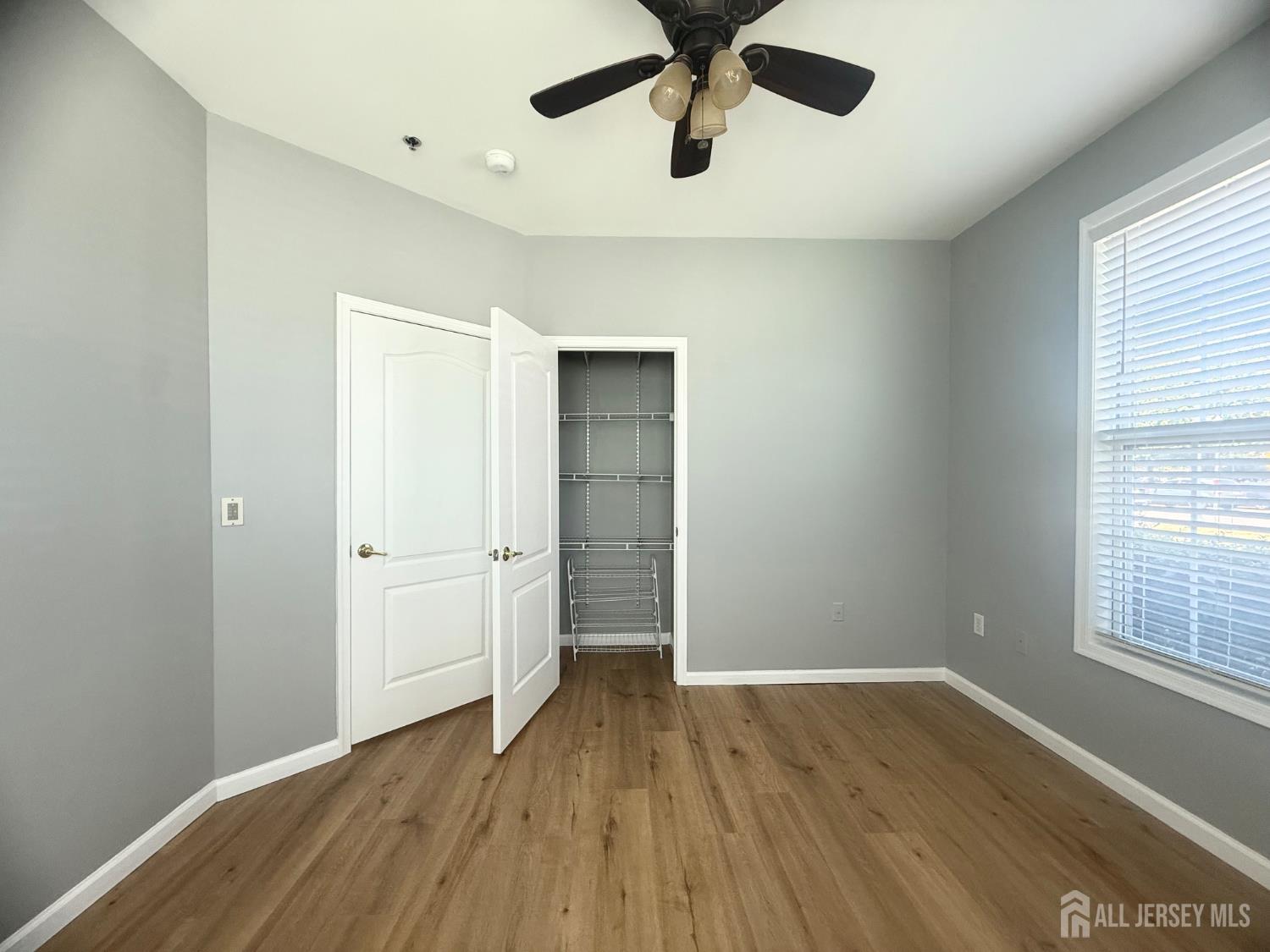3213 Edward Stec Boulevard Edison, NJ 08837 - Photo 10 of 30 wooden floor in an empty room with a window
