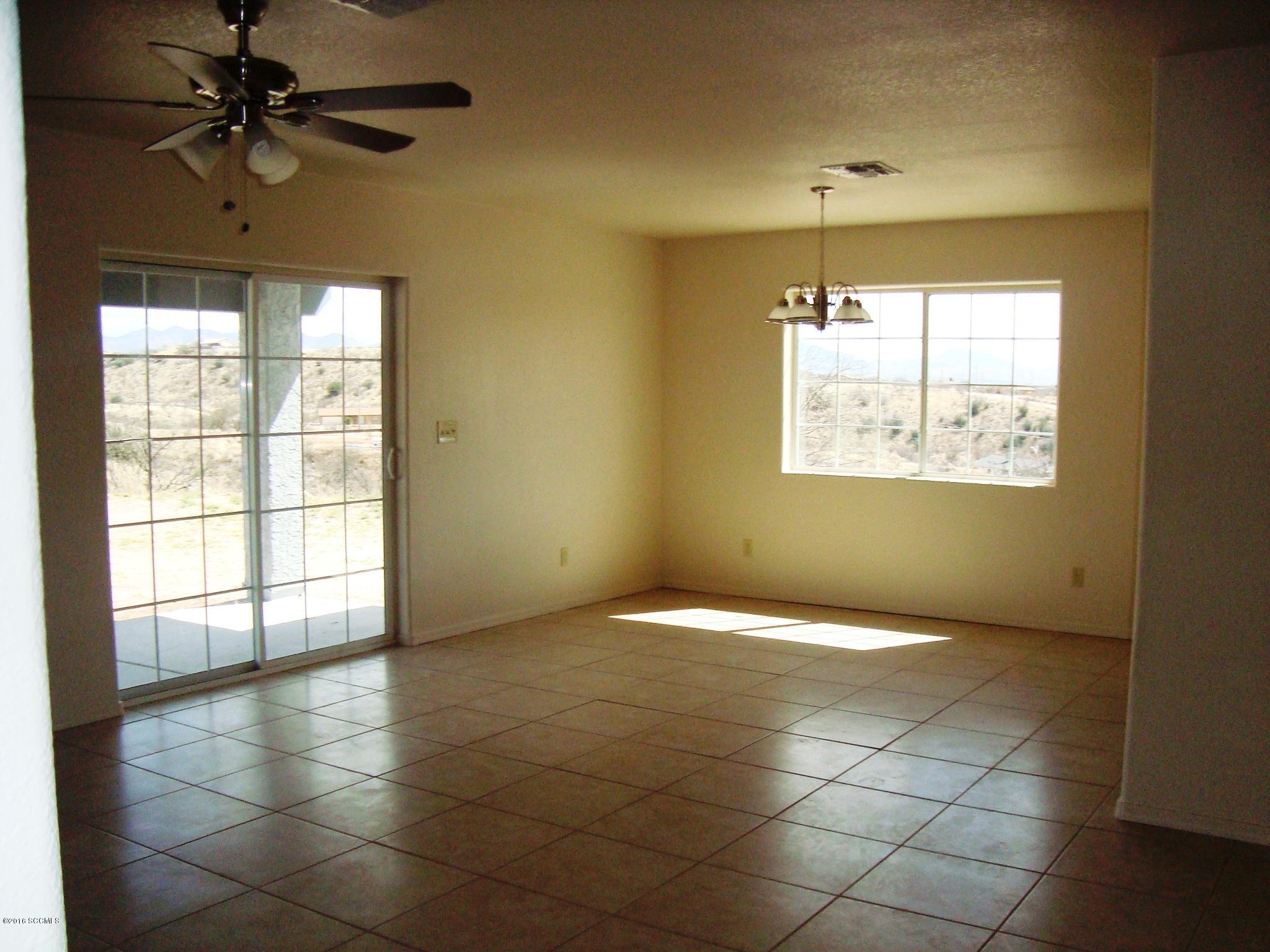 293 Guaymas Court Rio Rico, AZ 85648 - Photo 2 of 5 a view of an empty room with a window