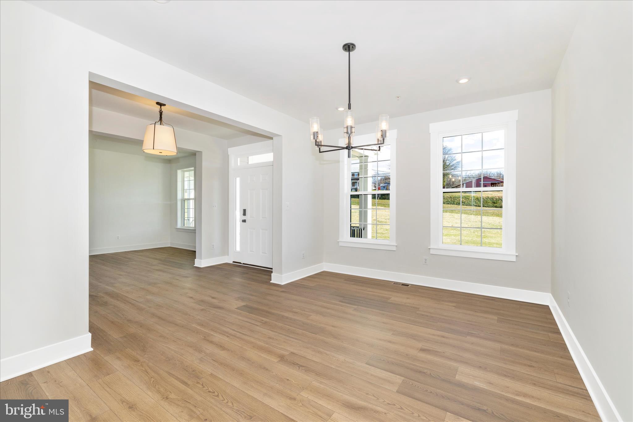 10242 Daysville Road Walkersville, MD 21793 - Photo 11 of 44 a view of an empty room with window and wooden floor