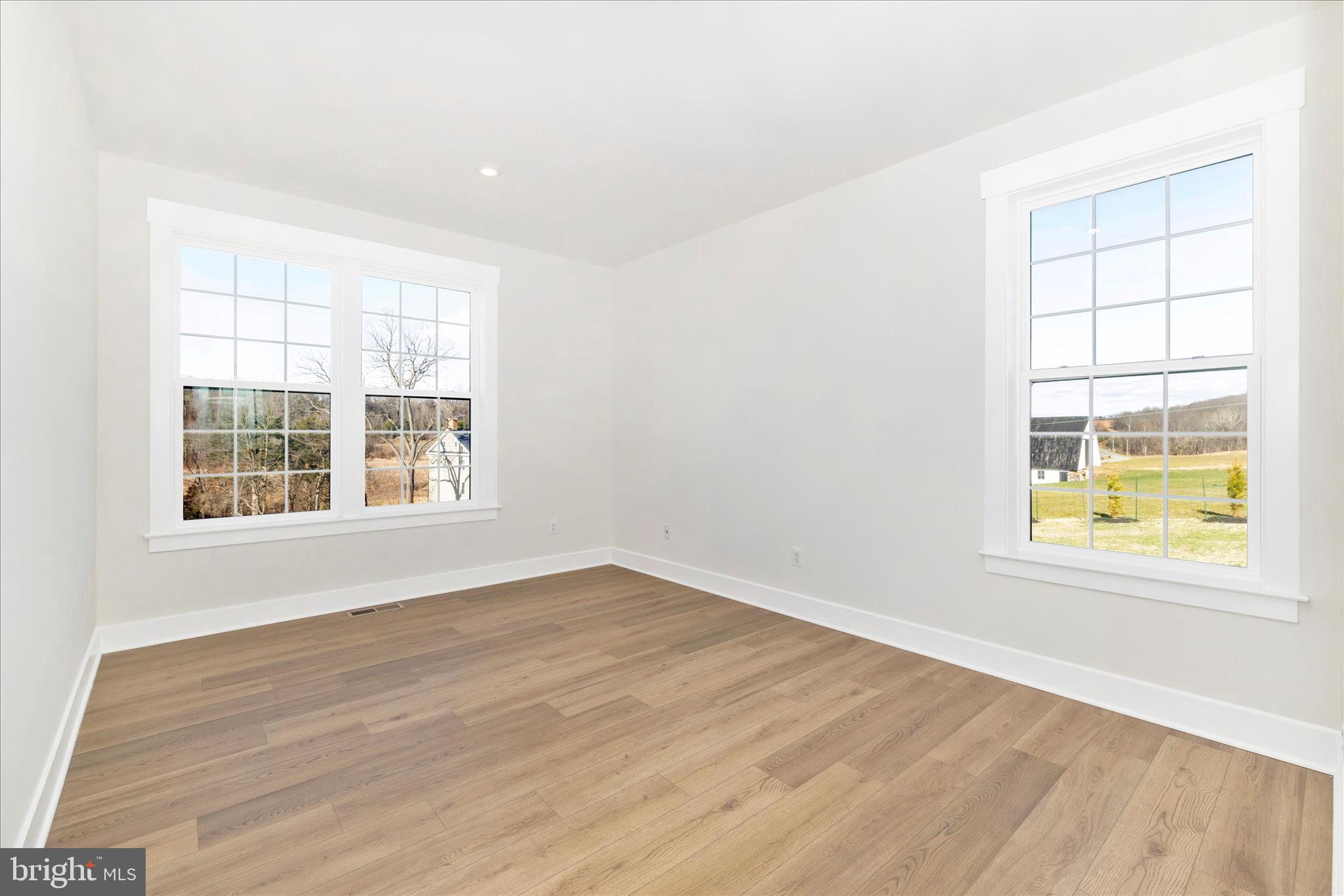 10242 Daysville Road Walkersville, MD 21793 - Photo 12 of 44 an empty room with wooden floor and windows