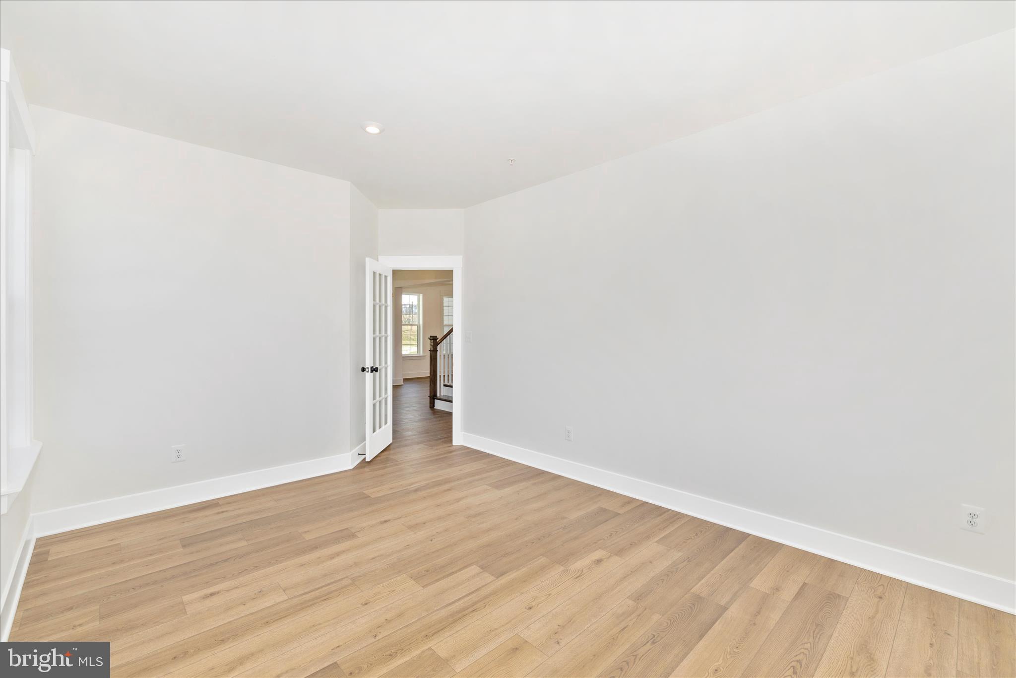 10242 Daysville Road Walkersville, MD 21793 - Photo 13 of 44 a view of an empty room with wooden floor