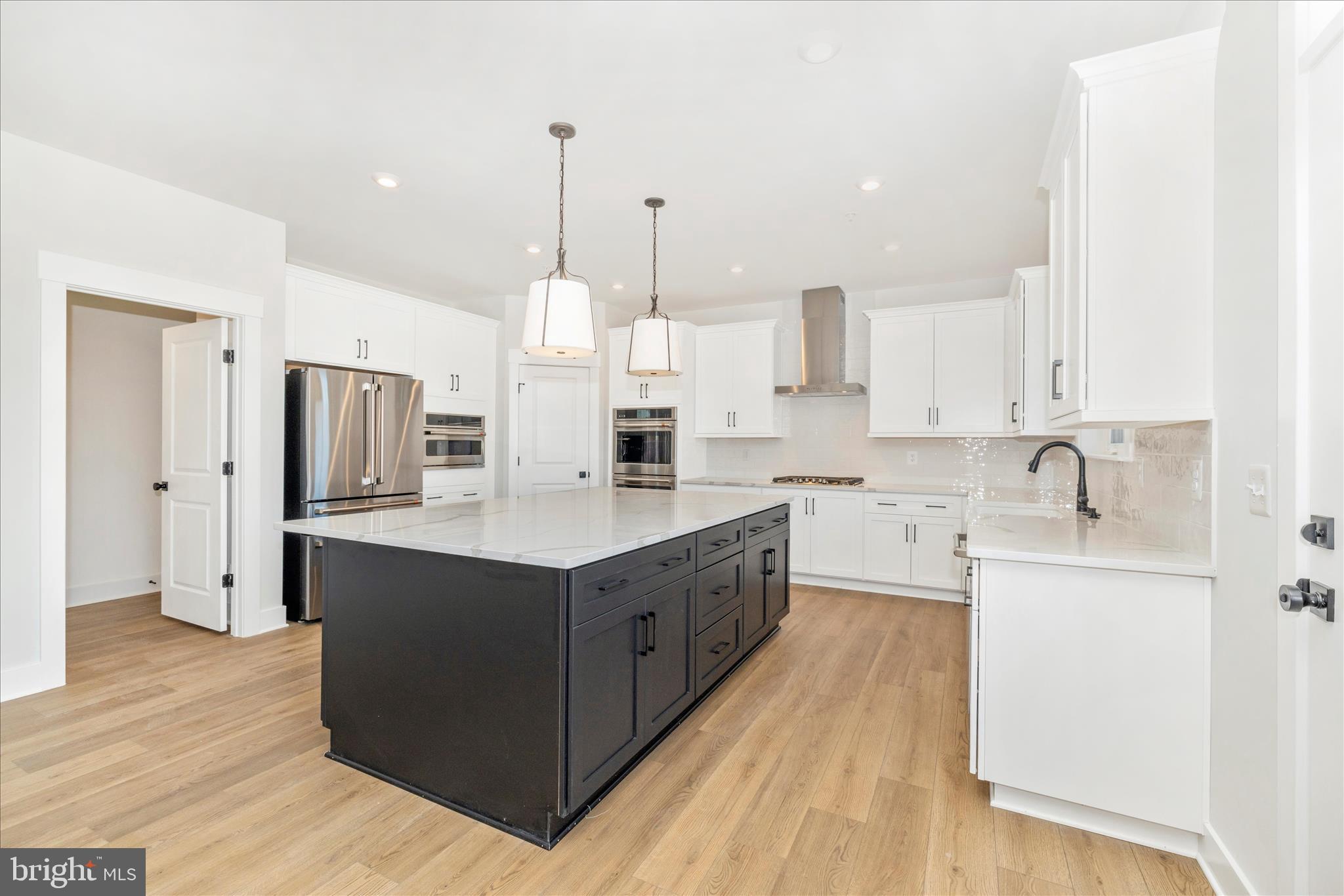 10242 Daysville Road Walkersville, MD 21793 - Photo 19 of 44 a large kitchen with stainless steel appliances sink refrigerator and cabinets