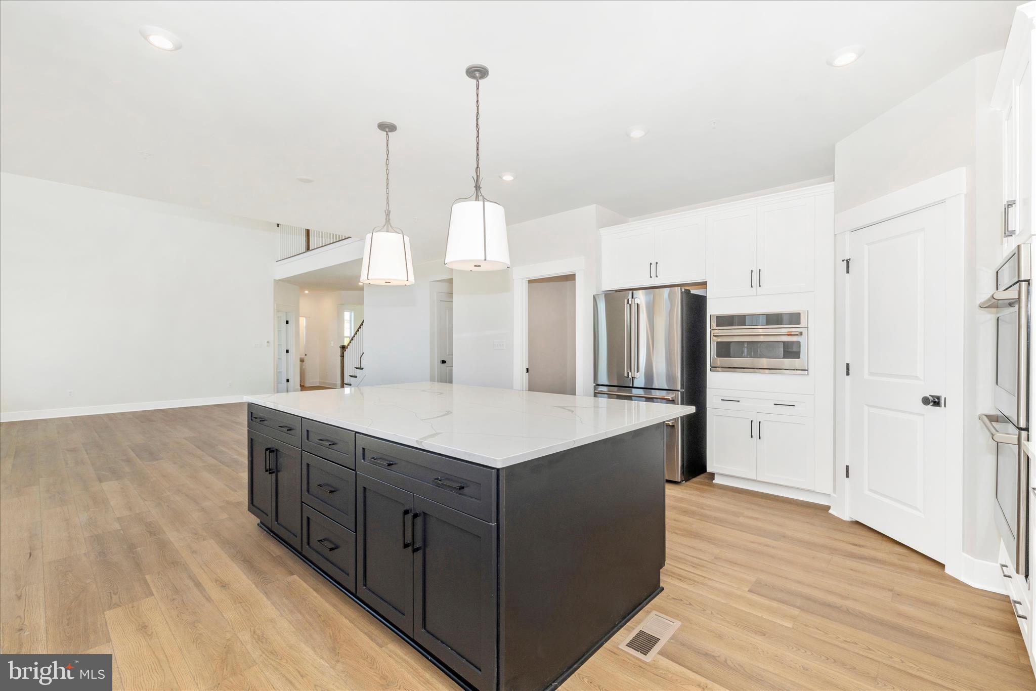 10242 Daysville Road Walkersville, MD 21793 - Photo 20 of 44 a kitchen with stainless steel appliances kitchen island granite countertop a sink a counter space and cabinets