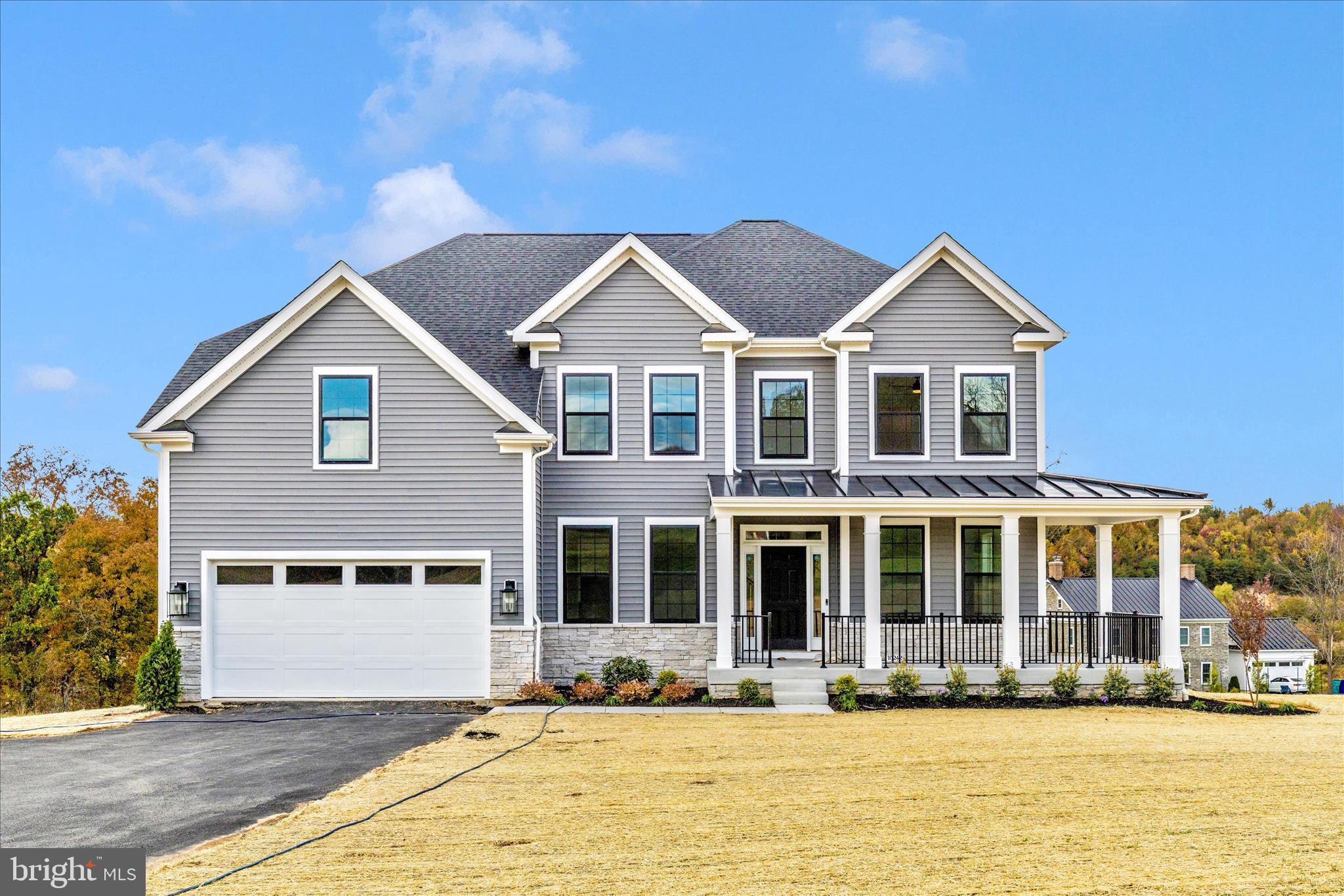 10242 Daysville Road Walkersville, MD 21793 - Photo 2 of 44 a front view of a house with a yard