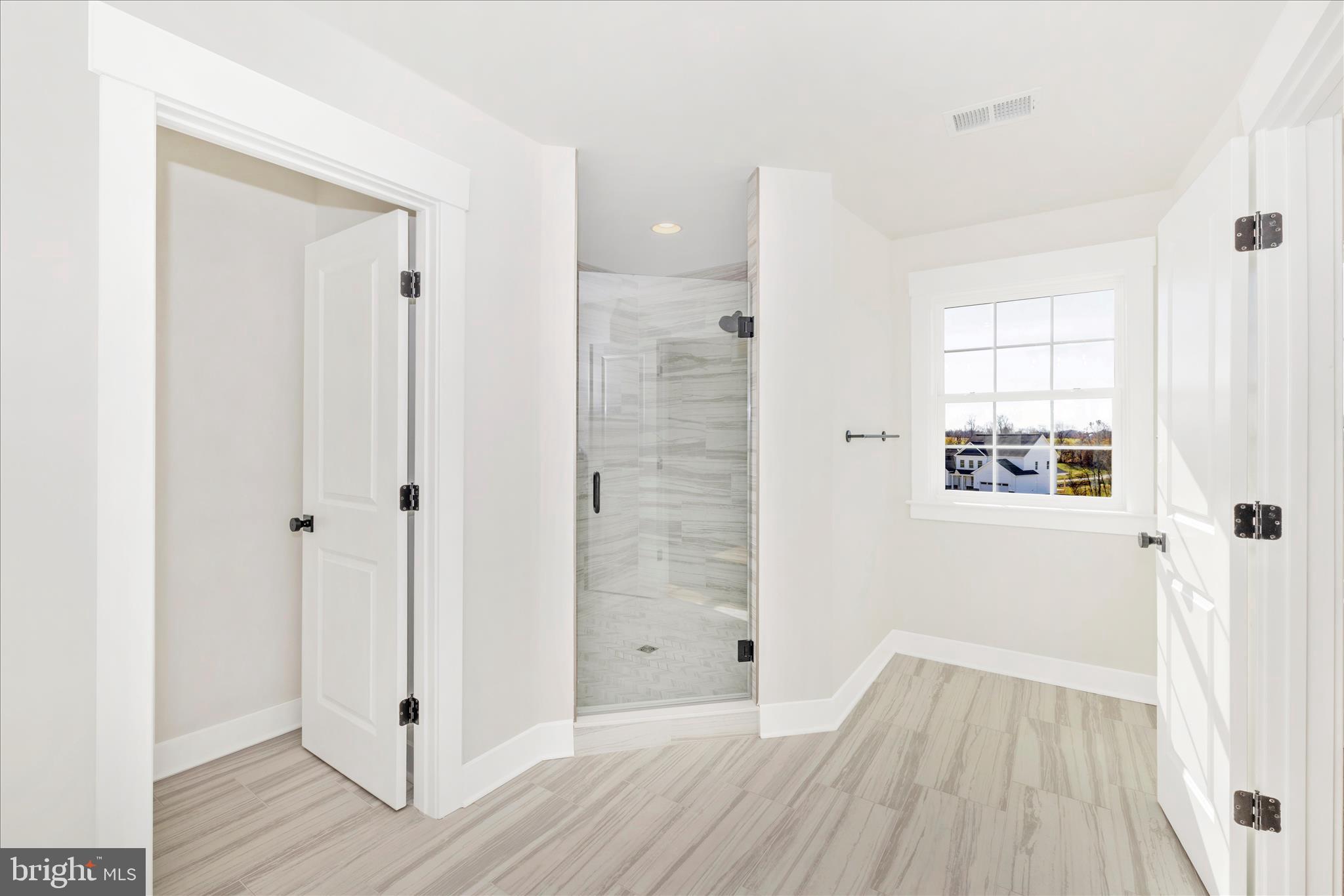 10242 Daysville Road Walkersville, MD 21793 - Photo 28 of 44 a view of a hallway with wooden floor and closet area