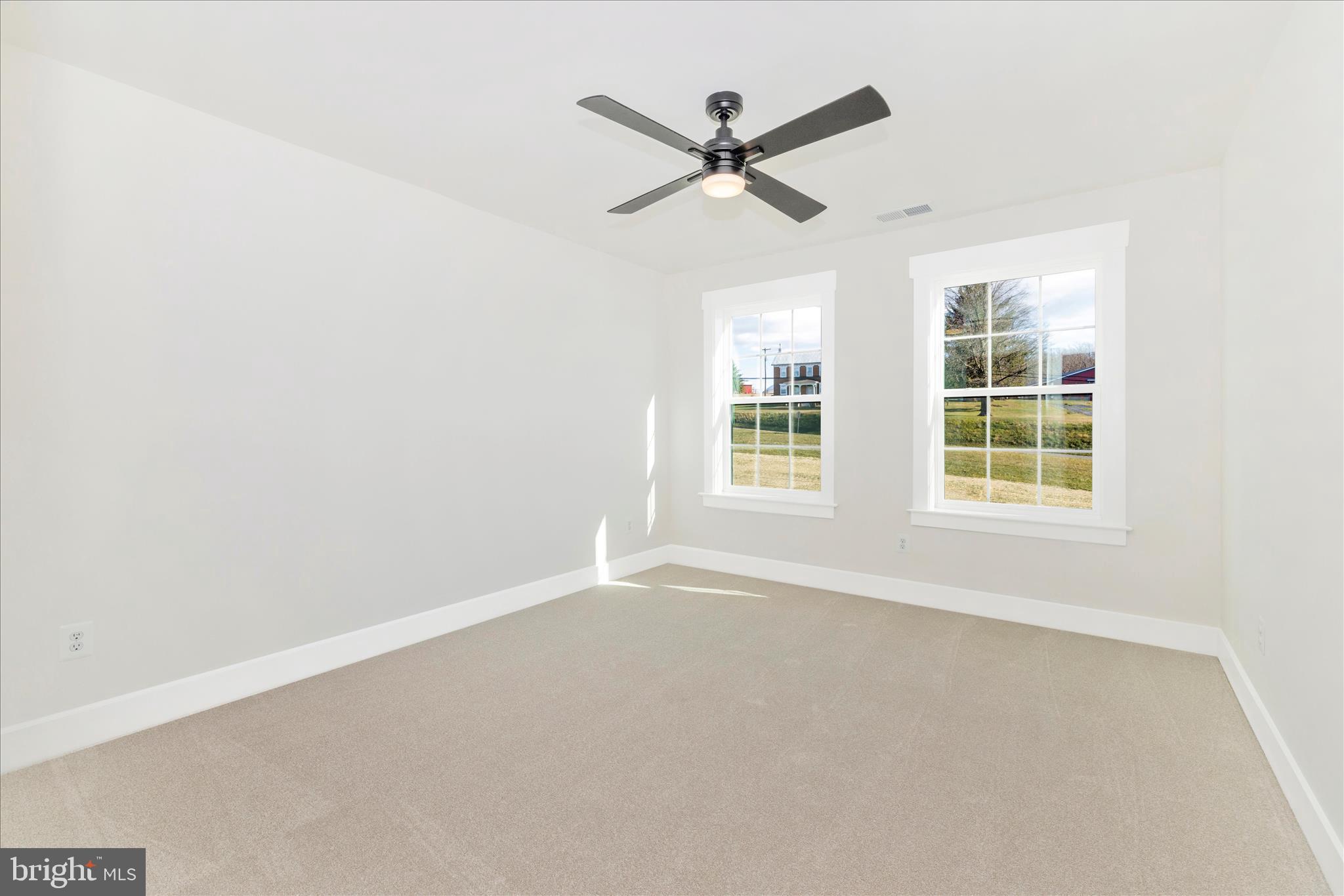 10242 Daysville Road Walkersville, MD 21793 - Photo 34 of 44 an empty room with ceiling fan and windows