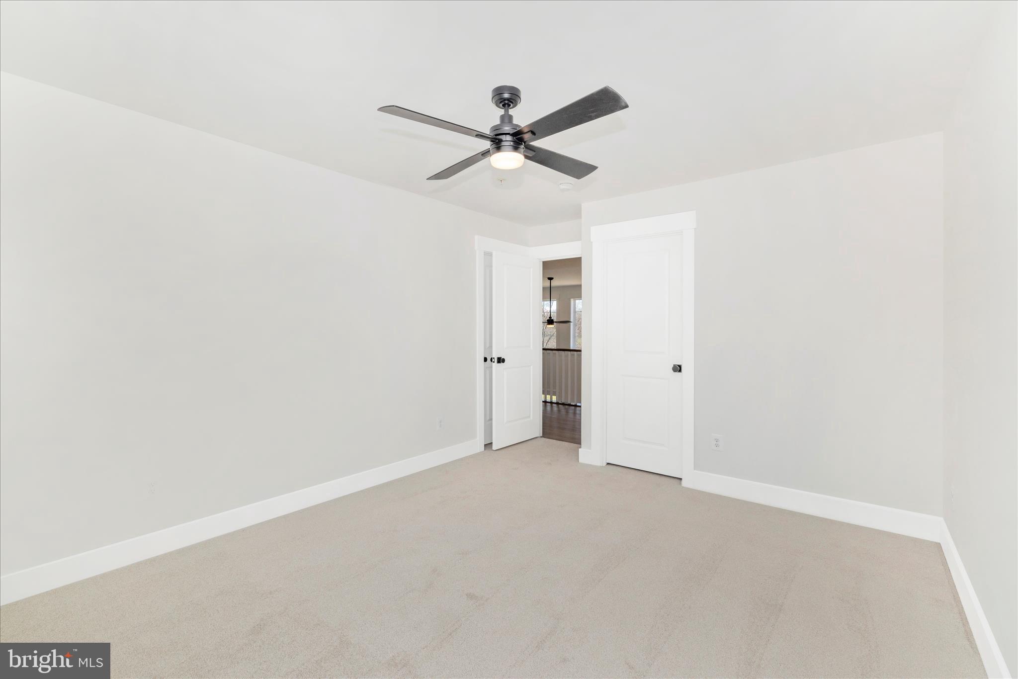 10242 Daysville Road Walkersville, MD 21793 - Photo 35 of 44 an empty room with closet and ceiling fan
