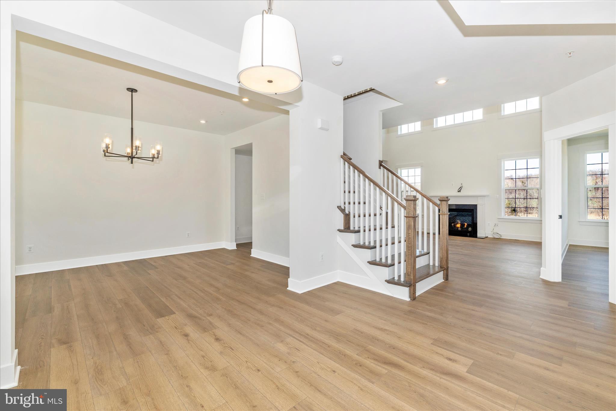 10242 Daysville Road Walkersville, MD 21793 - Photo 7 of 44 a view of a hallway with wooden floor and staircase