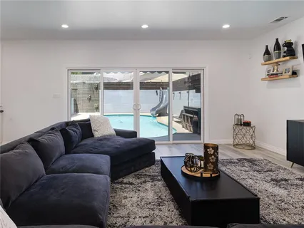 a kitchen with stainless steel appliances granite countertop a sink a counter top space and stainless steel appliances