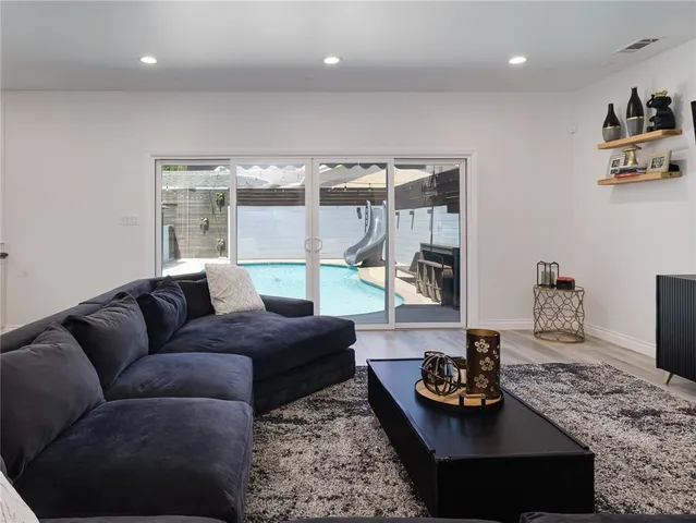 a kitchen with stainless steel appliances granite countertop a sink a counter top space and stainless steel appliances