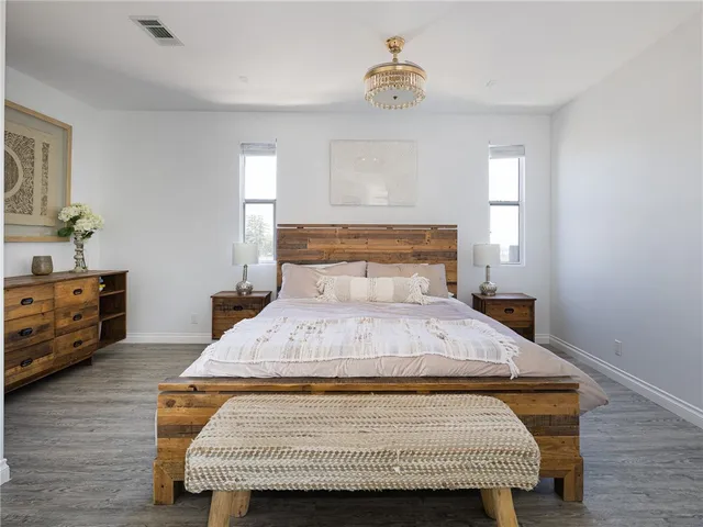 a bathroom with double vanity and a shower