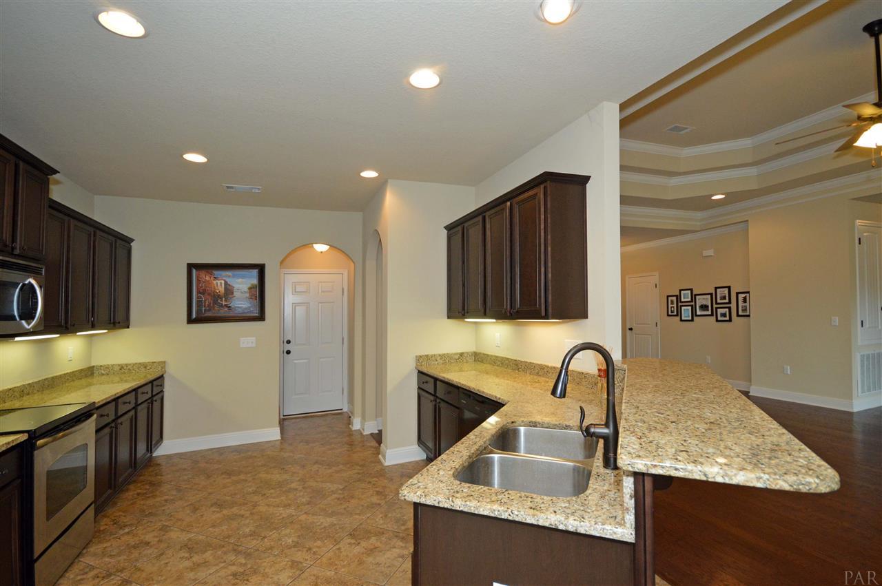 759 Lake Ridge Lane Pensacola, FL 32514 - Photo 16 of 43 a kitchen that has a sink and a stove in it