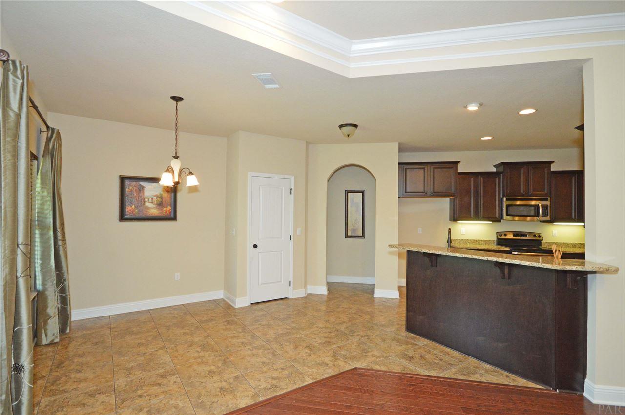 759 Lake Ridge Lane Pensacola, FL 32514 - Photo 19 of 43 a view of a kitchen with kitchen island a sink stainless steel appliances and cabinets
