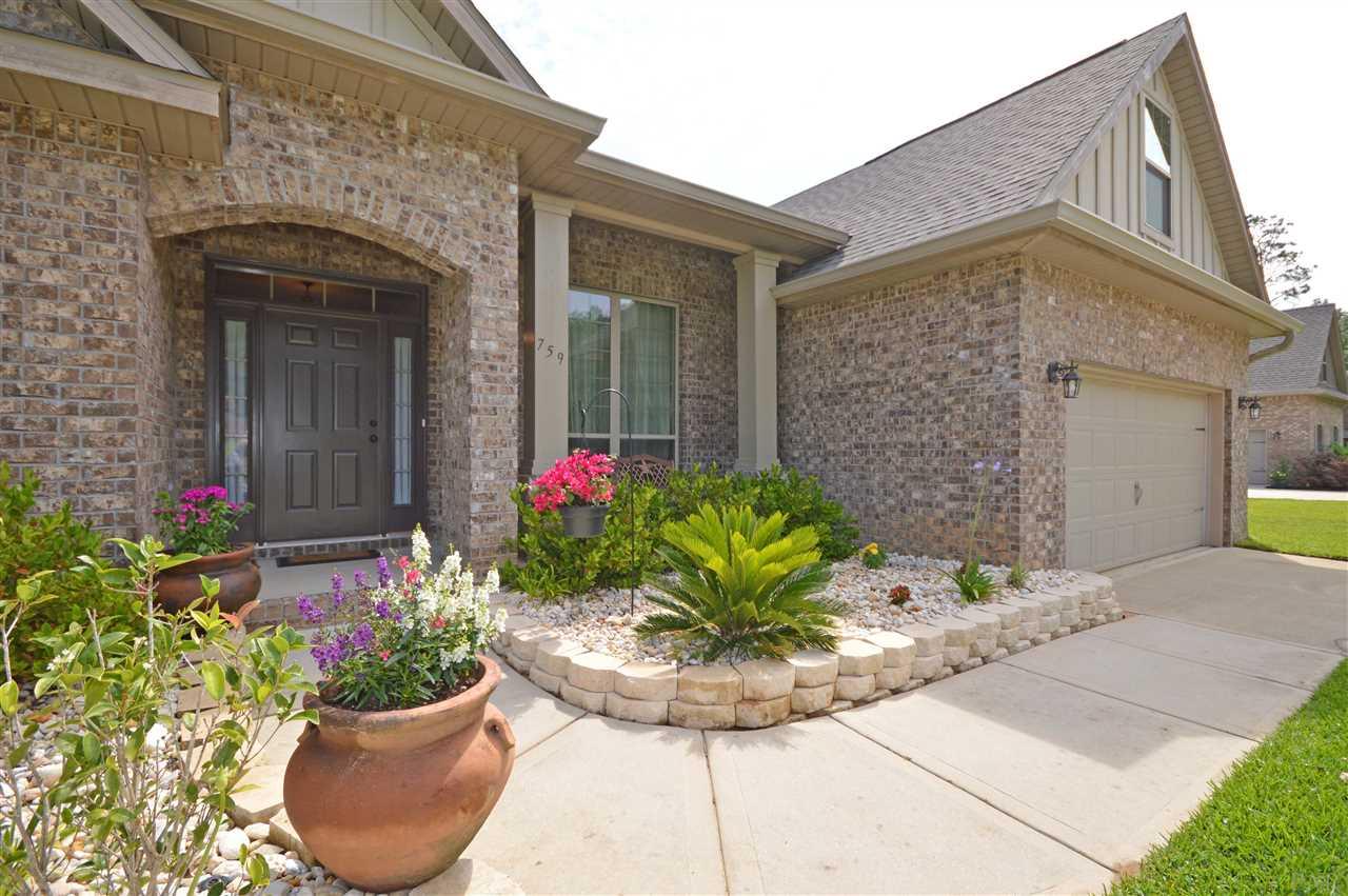 759 Lake Ridge Lane Pensacola, FL 32514 - Photo 2 of 43 a view of a house with potted plants