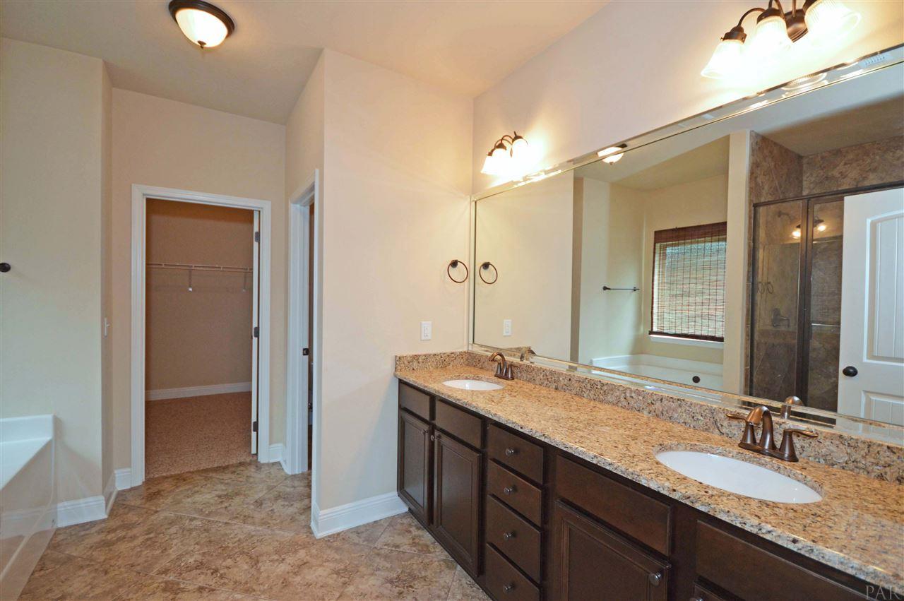 759 Lake Ridge Lane Pensacola, FL 32514 - Photo 22 of 43 a bathroom with a granite countertop double vanity sink and a mirror