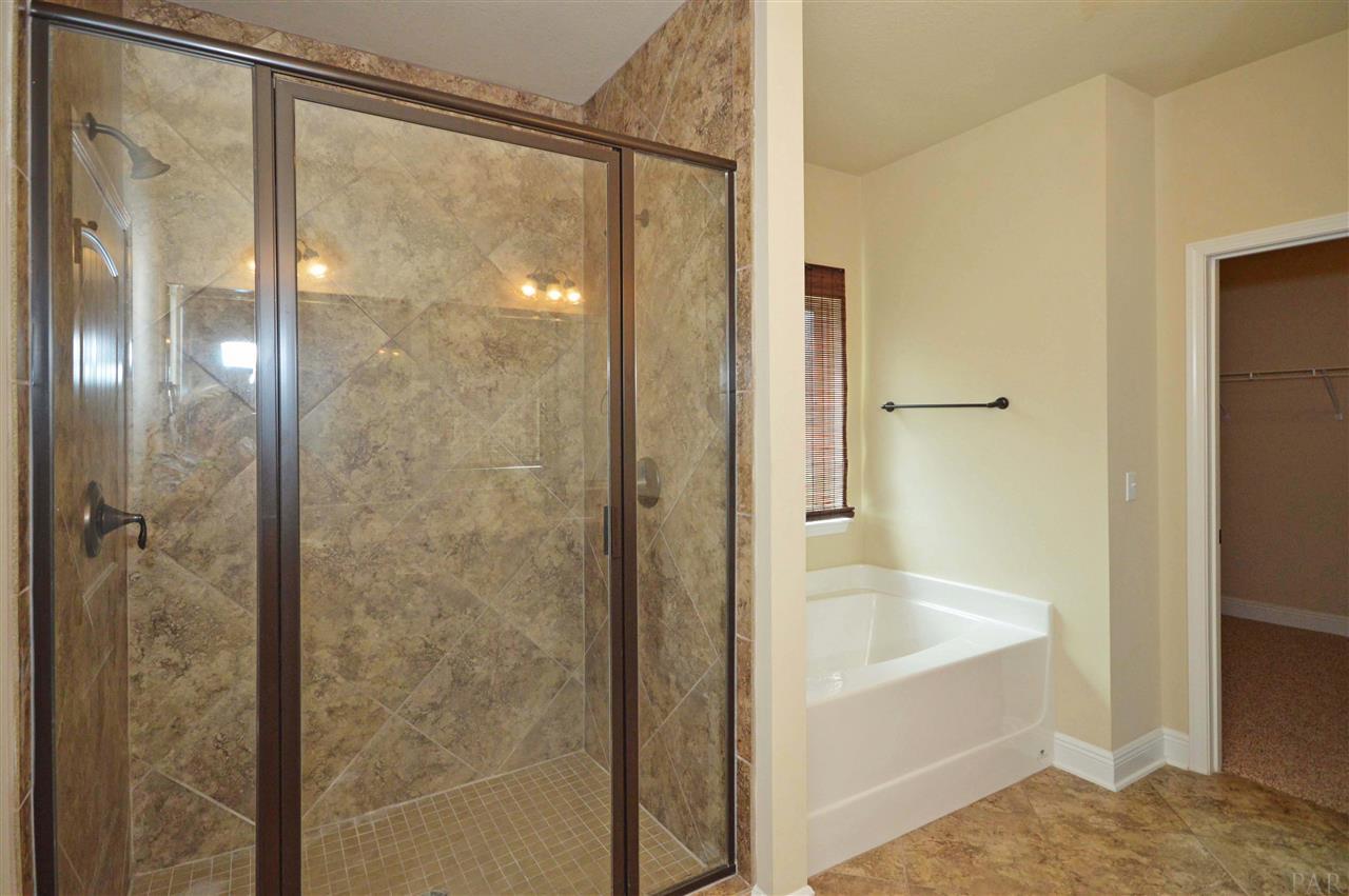 759 Lake Ridge Lane Pensacola, FL 32514 - Photo 24 of 43 a bathroom with a bathtub and a shower