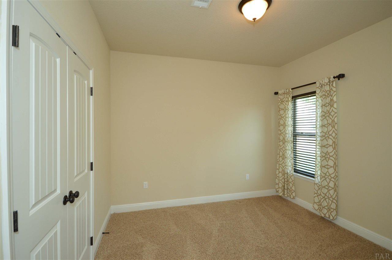 759 Lake Ridge Lane Pensacola, FL 32514 - Photo 28 of 43 a view of an empty room with a window