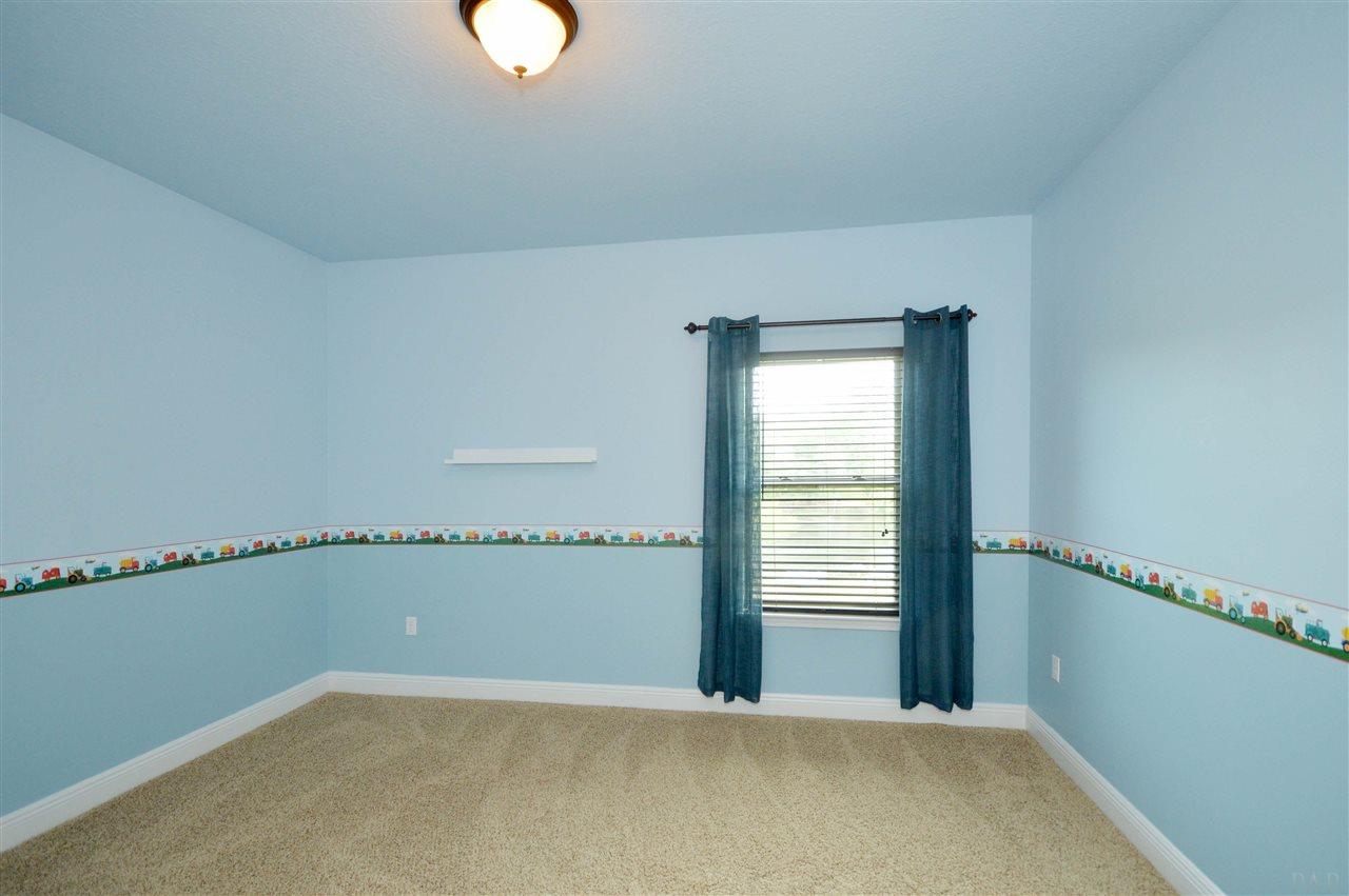 759 Lake Ridge Lane Pensacola, FL 32514 - Photo 33 of 43 a view of an empty room with a window
