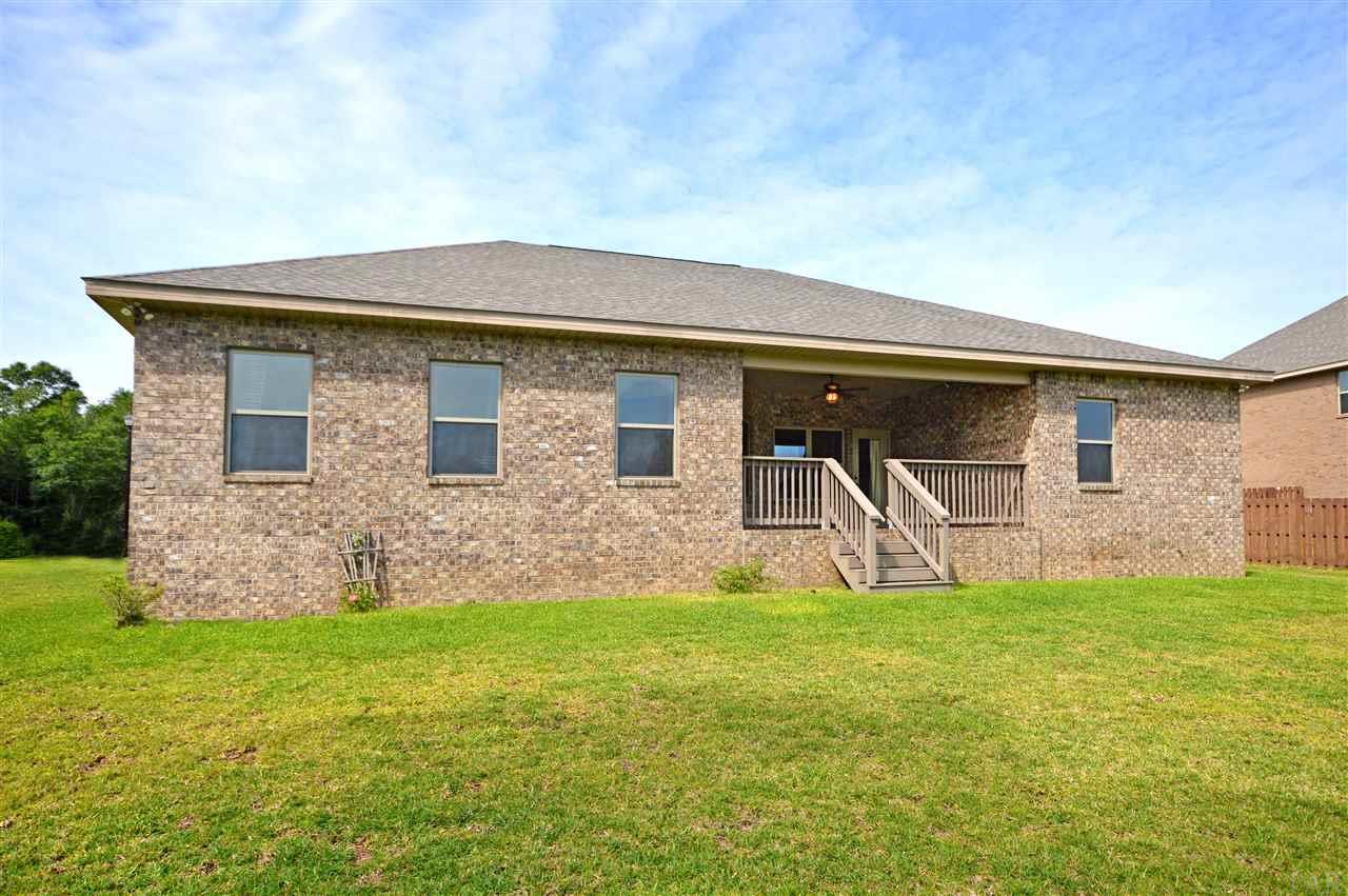 759 Lake Ridge Lane Pensacola, FL 32514 - Photo 36 of 43 a front view of house with yard and green space