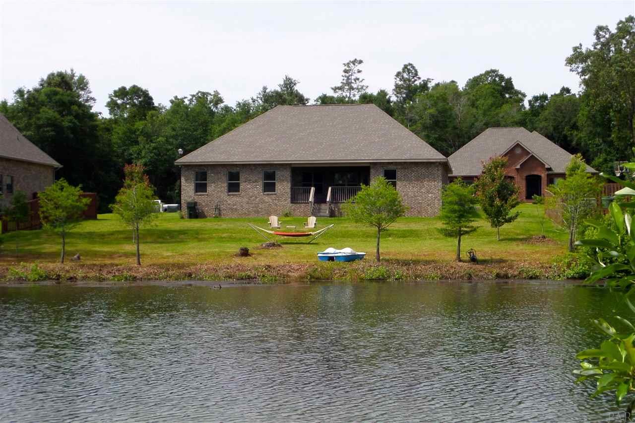 759 Lake Ridge Lane Pensacola, FL 32514 - Photo 37 of 43 a view of a house with a yard